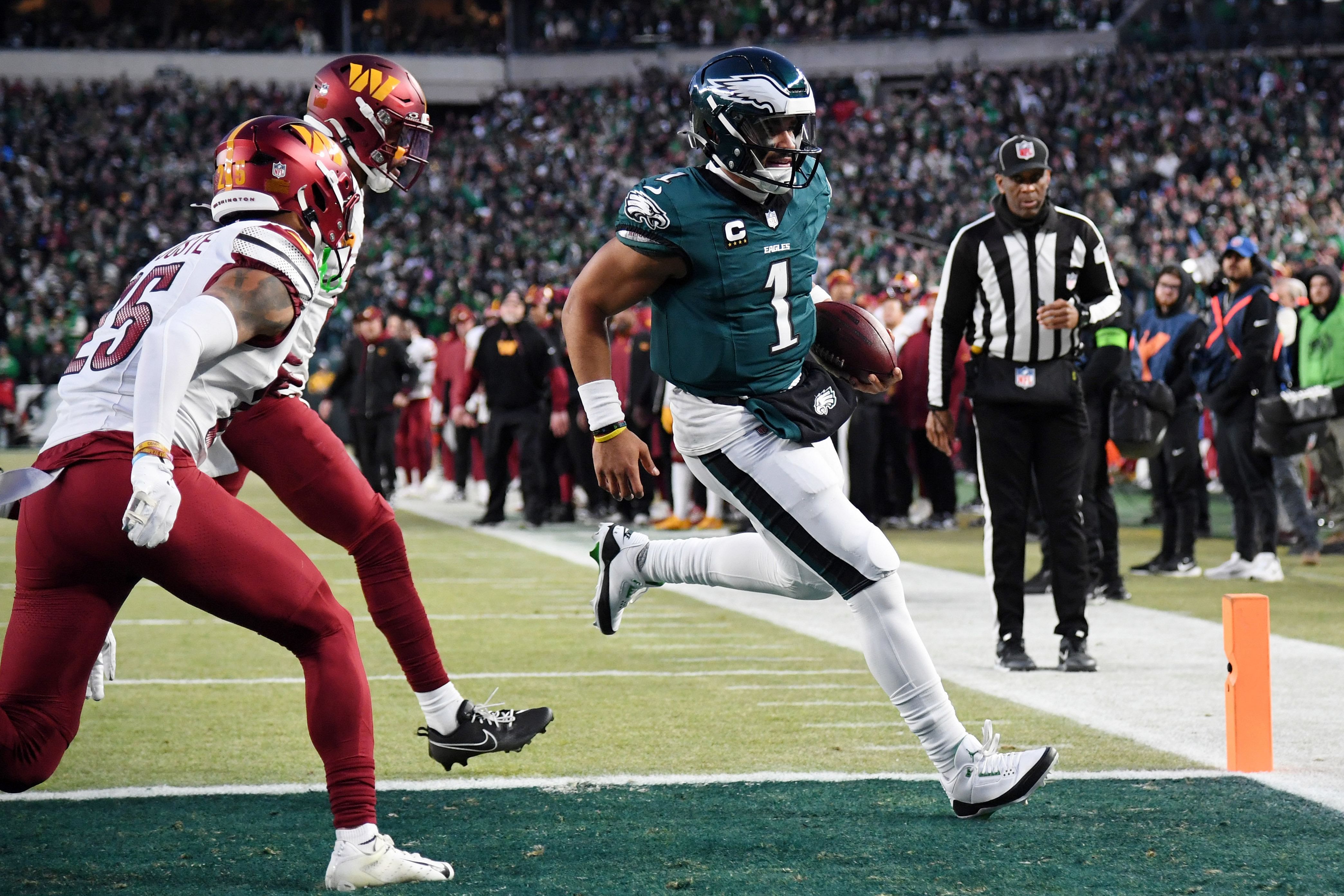 Philadelphia Eagles quarterback Jalen Hurts (1) runs with the ball for a touchdown against the Washington Commanders during the second half of the NFC Championship game at Lincoln Financial Field. (Credits: IMAGN)