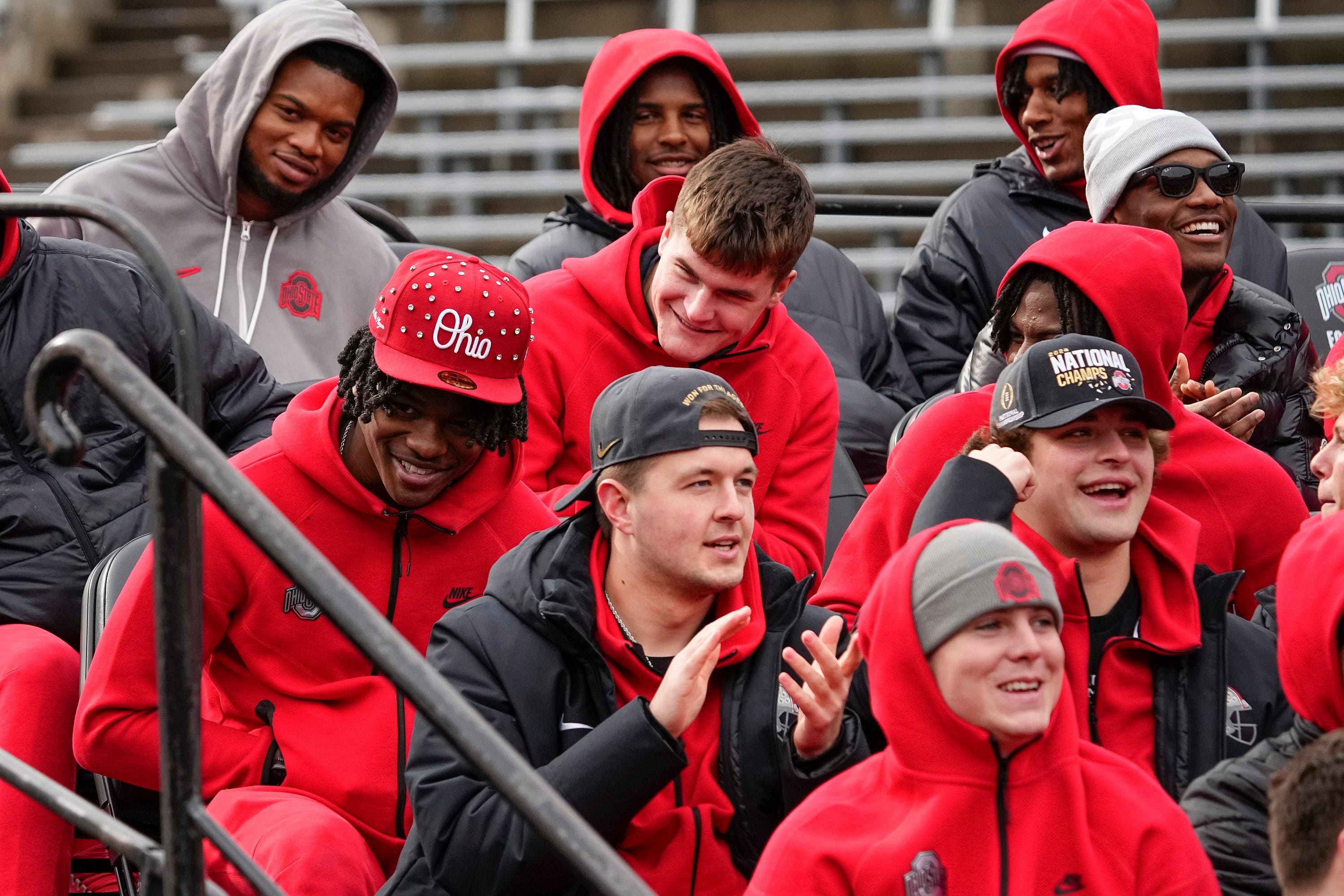 Ohio State Buckeyes offensive players, including Jeremiah Smith, left, and Carnell Tate, right, watch during the Ohio State Buckeyes College Football Playoff national championship celebration at Ohio Stadium - Source: Imagn