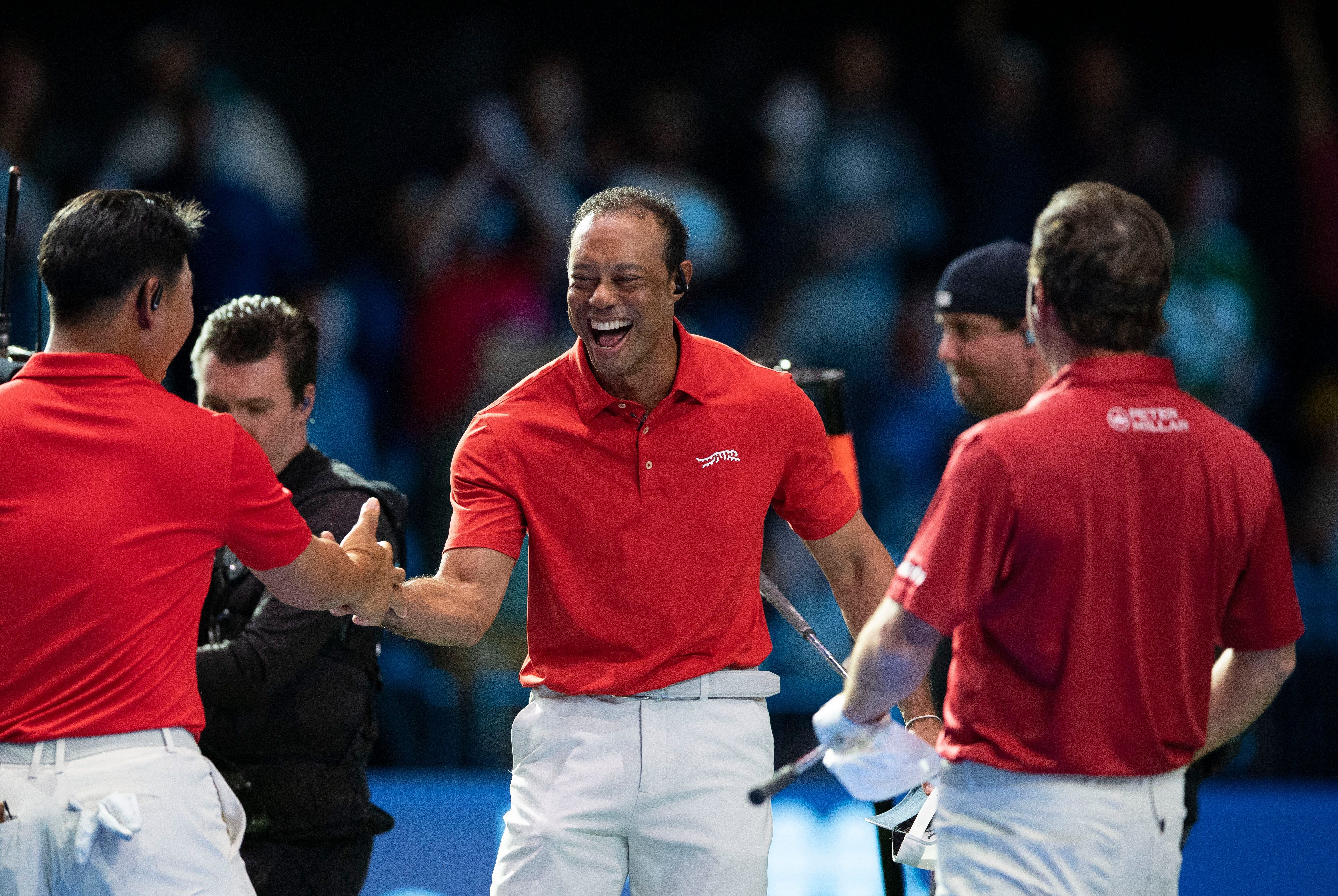 Tiger Woods of Jupiter Links celebrates the win with Tom Kim (left) and Kevin Kisner (right) during a TGL match against Bottom Common (Image Source: Imagn)