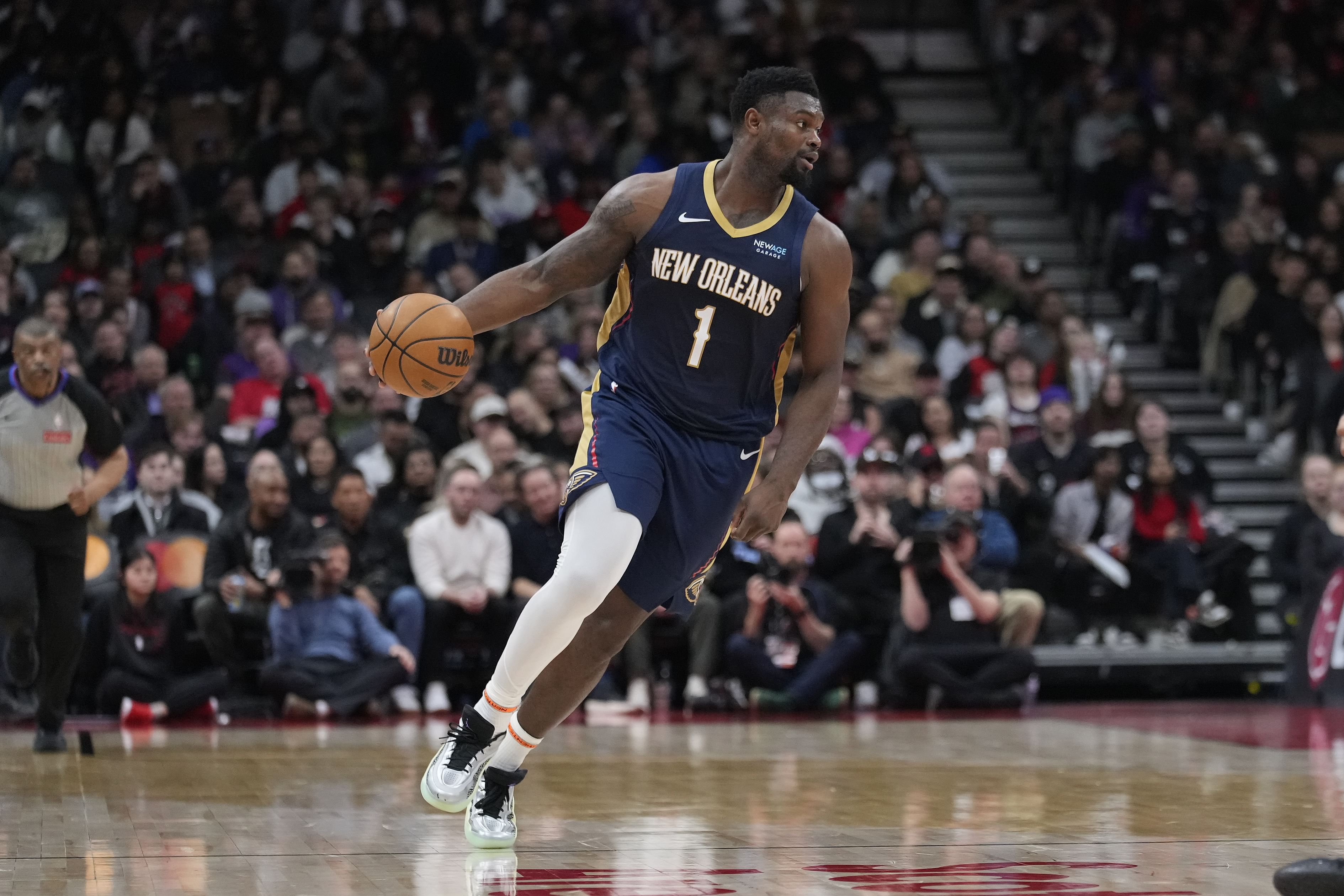 New Orleans Pelicans forward Zion Williamson dribbles the ball against the Toronto Raptors at Scotiabank Arena. Photo Credit: Imagn