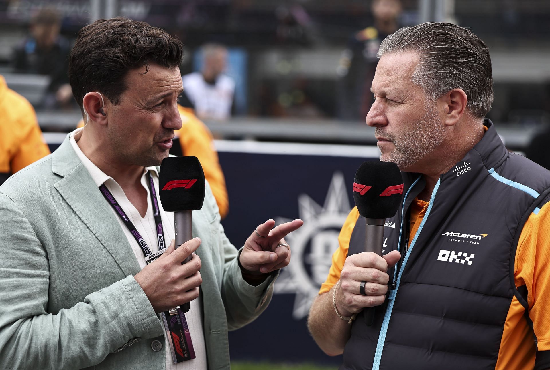 Will Buxton (L) and Zak Brown(R) at the F1 Grand Prix of Belgium - Source: Getty