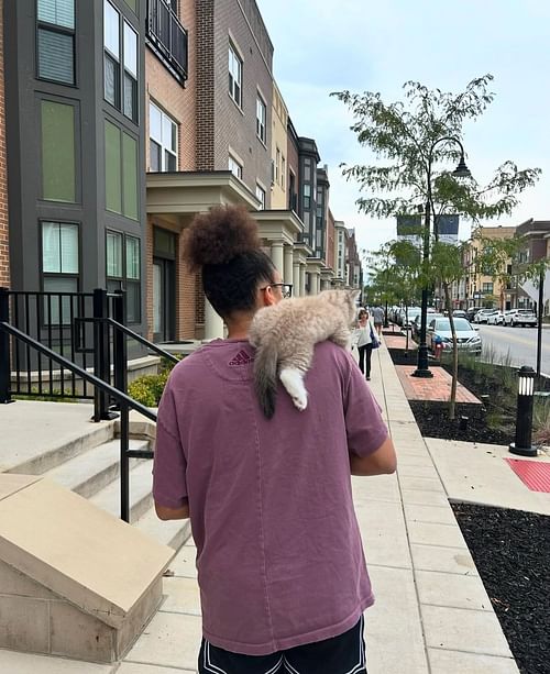 Bean perched on his mom Olivia Miles' shoulder.