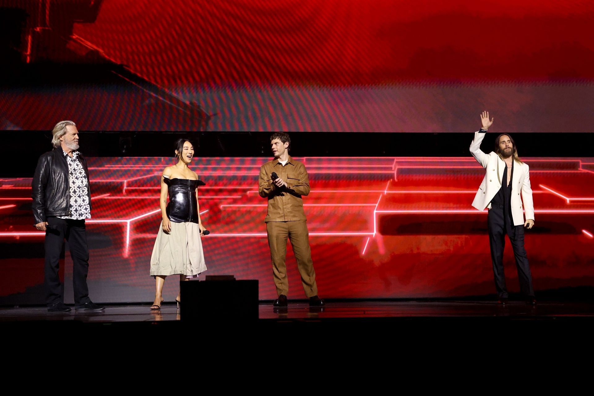 Cast of Tron: Ares Jeff Bridges, Greta Lee, Evan Peters and Jared Leto at the Disney Entertainment Showcase at D23 (Image via Getty)