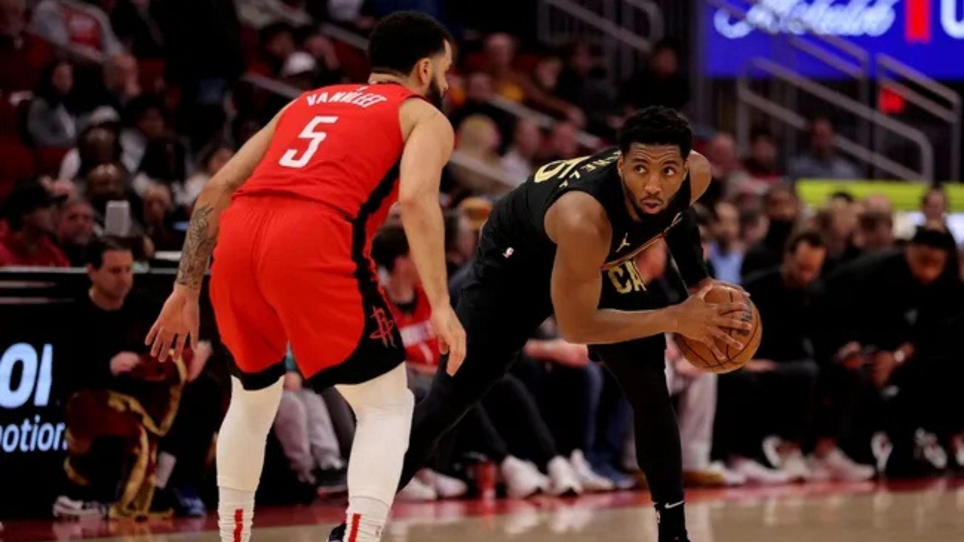 Cleveland Cavaliers guard Donovan Mitchell handles the ball against Houston Rockets guard Fred VanVleet at Toyota Center. Photo Credit: Imagn