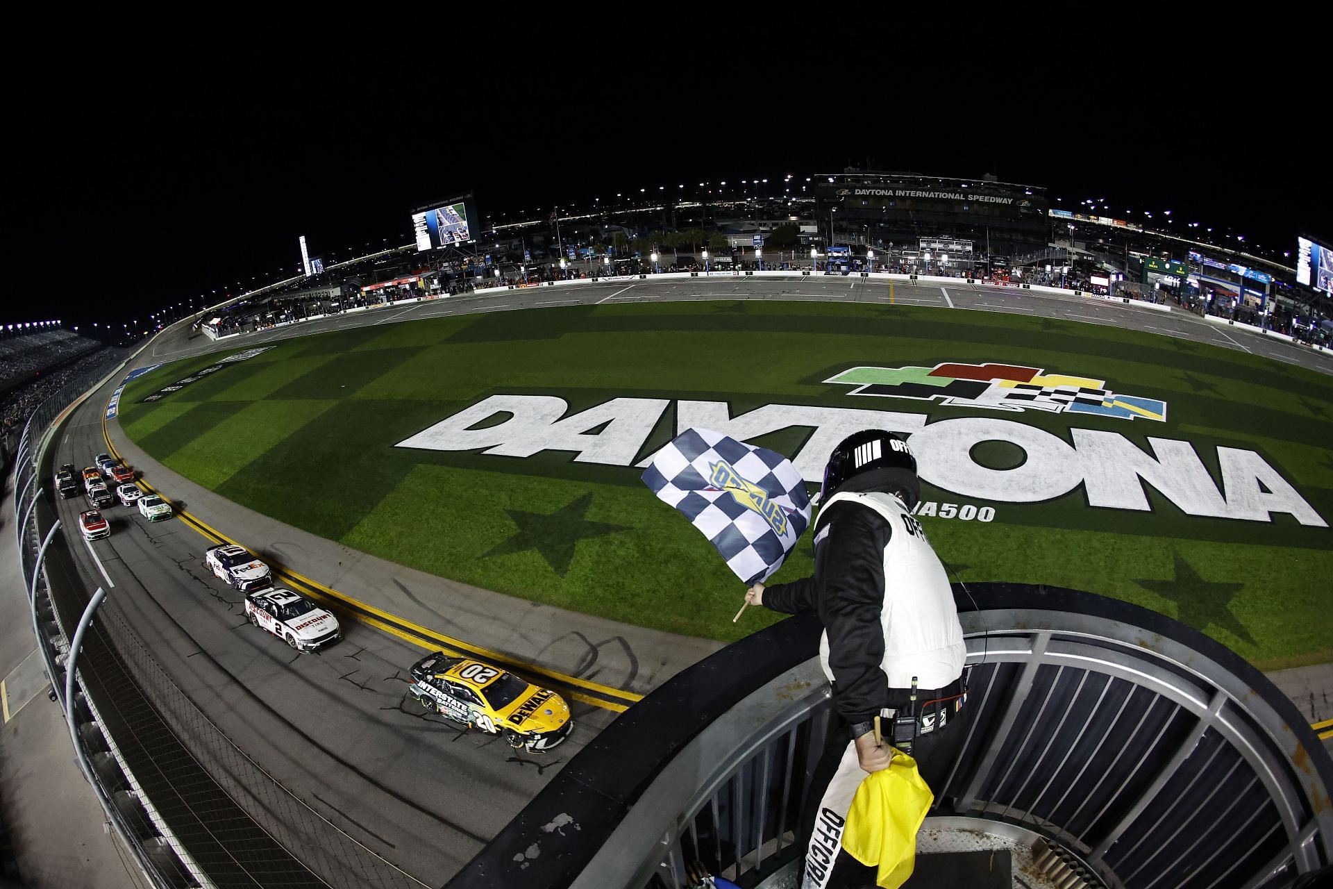 DAYTONA BEACH, FLORIDA - FEBRUARY 15: Christopher Bell, driver of the #20 DEWALT/Interstate Batteries Toyota, takes the checkered flag to win  the NASCAR Cup Series Bluegreen Vacations Duel #2 at Daytona International Speedway on February 15, 2024 in Daytona Beach, Florida. (Photo by James Gilbert/Getty Images) - Source: Getty