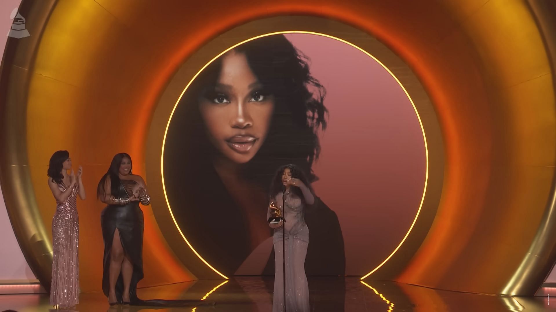 SZA accepting a Grammy for her song &quot;Snooze&quot;. (Image via Recording Academy)