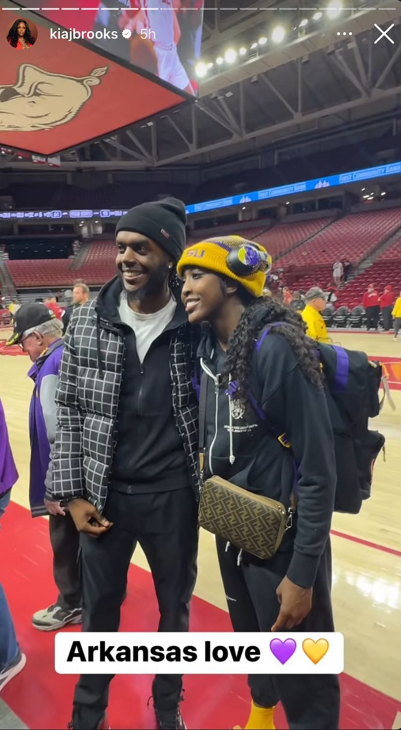 A fan posing with Flau&#039;jae Johnson after LSU&#039;s win over Arkansas