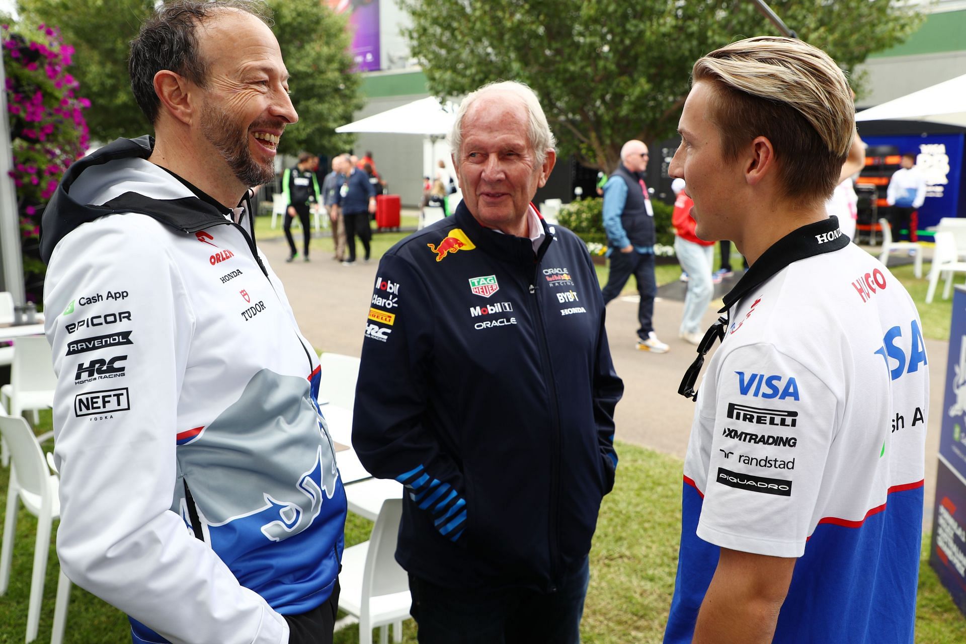 Peter Bayer, CEO of Visa Cash App RB, Dr Helmut Marko and Liam Lawson talk in the Paddock prior to the F1 Grand Prix of Australia - Source: Getty