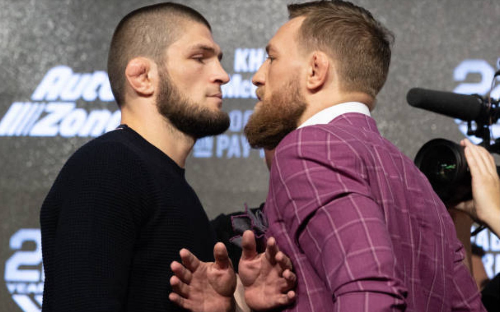 Khabib Nurmagomedov (left) reacts to Conor McGregor