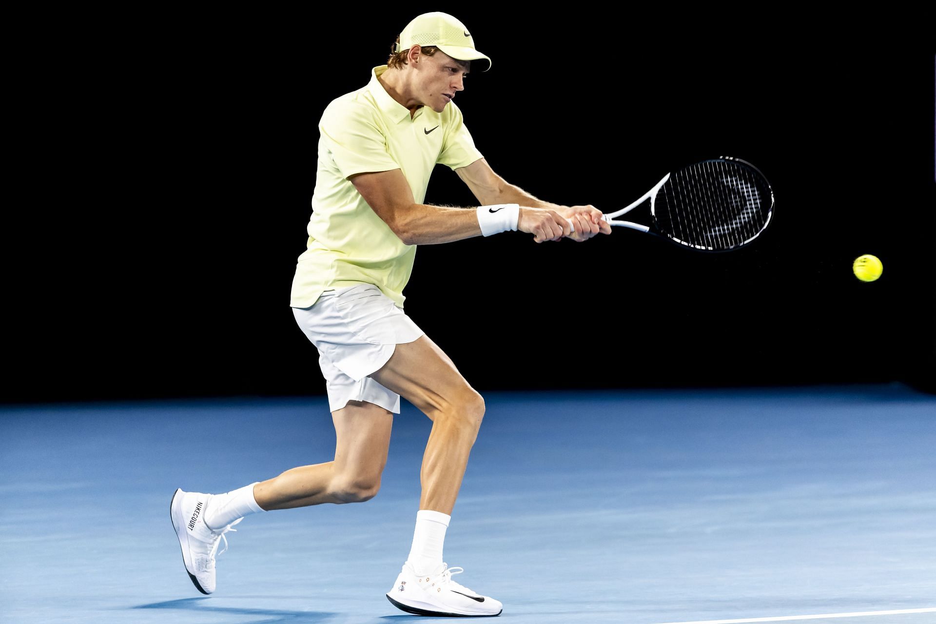 Jannik Sinner hits a backhand at Australian Open 2025