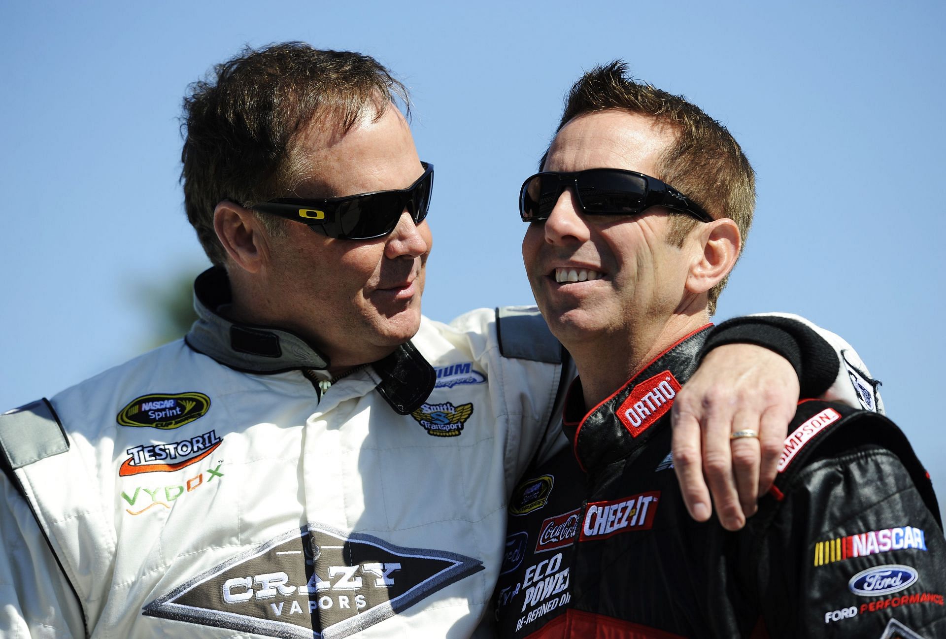 Mike Wallace (L), driver of the #66 Crazy Vapors/X8 Energy Gum Toyota, talks to Greg Biffle, driver of the #16 Ortho Ford, on the grid - Source: Getty Images