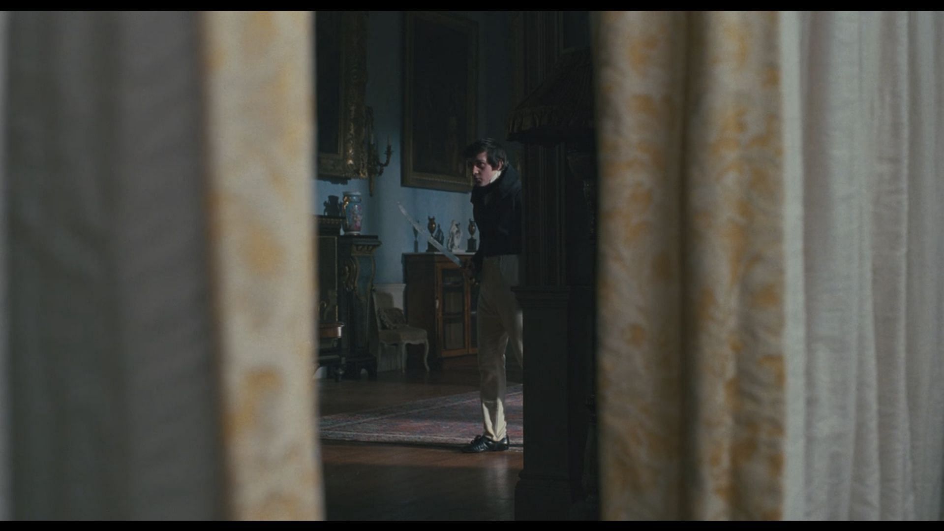 A still of Edward Rochester practicing his combat skills in Jane Eyre (Image via Prime Video)