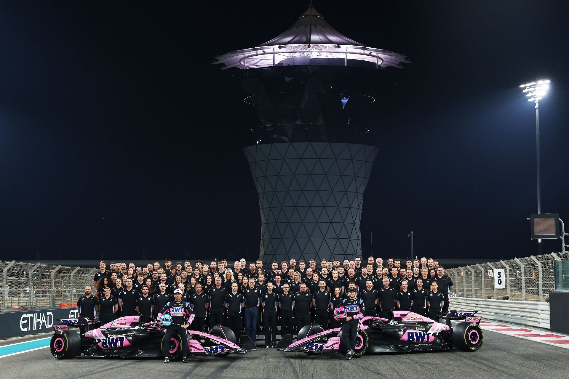 Pierre Gasly and Jack Doohan pose for the Alpine Team Photo with their team after qualifying ahead of the F1 Grand Prix of Abu Dhabi - Source: Getty