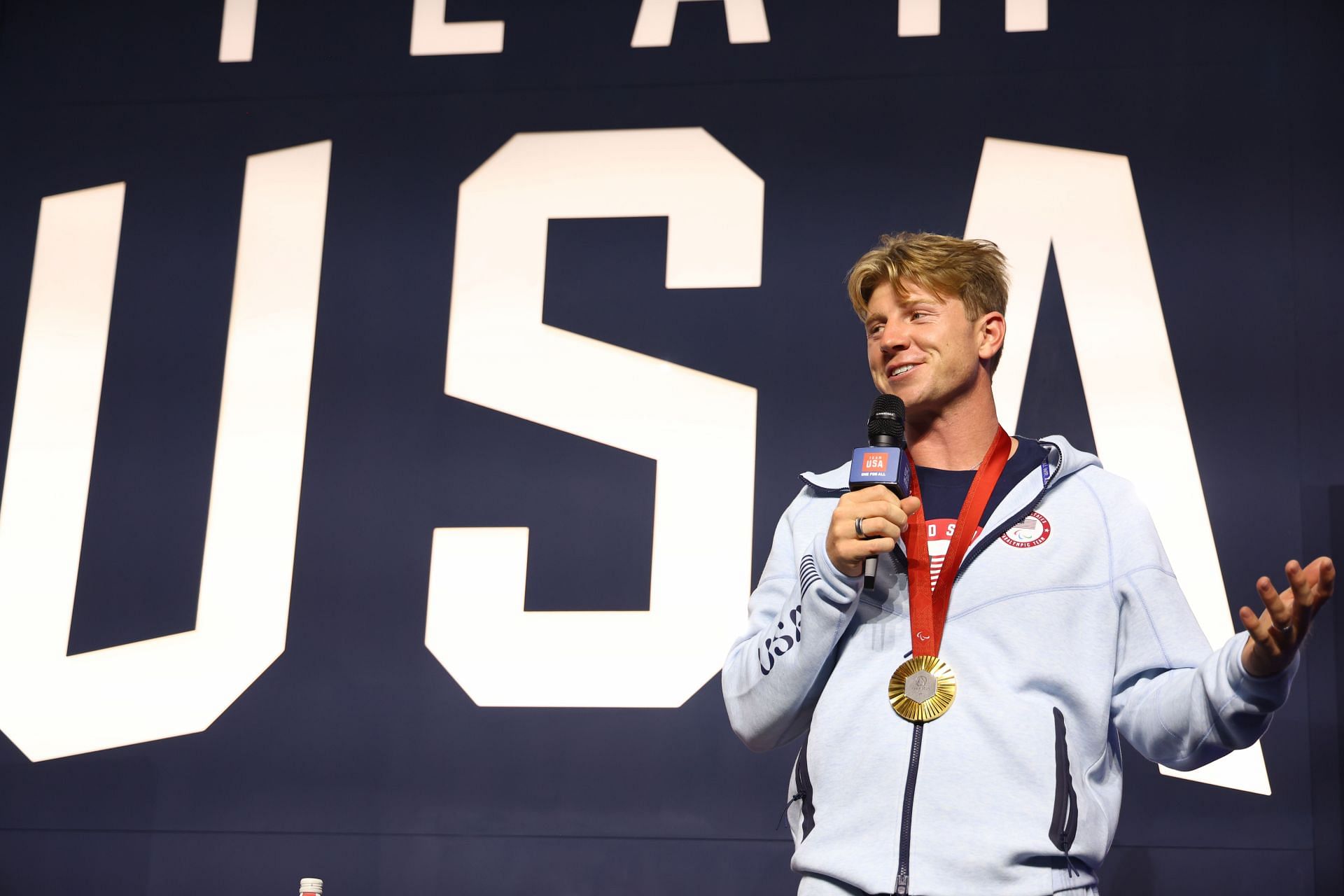 Hunter Woodhall speaks at the USA House at (Image Source: Getty)