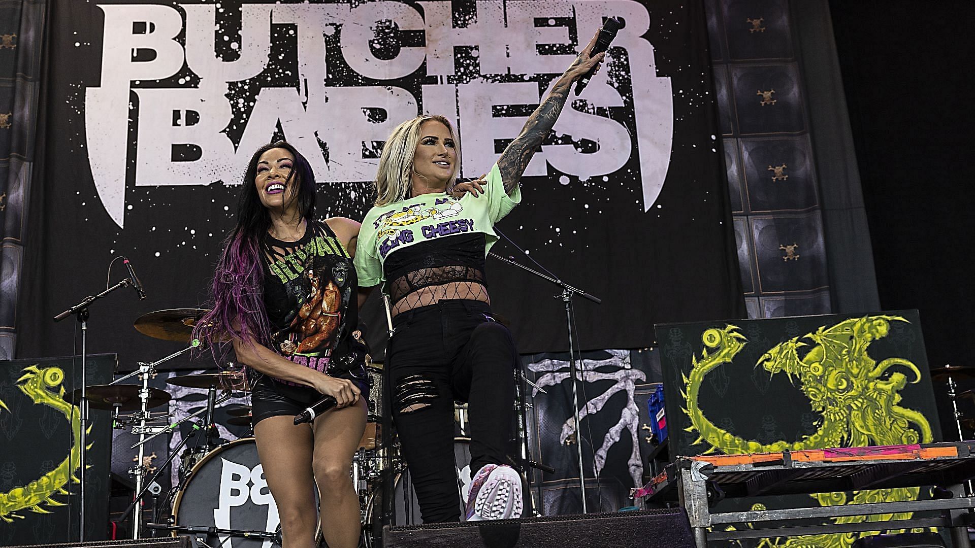 Singer Carla Harvey (L) and singer Heidi Shepherd of Butcher Babies perform at PNC Music Pavilion on July 23, 2023, in Charlotte, North Carolina. (Image via Getty/Jeff Hahne)