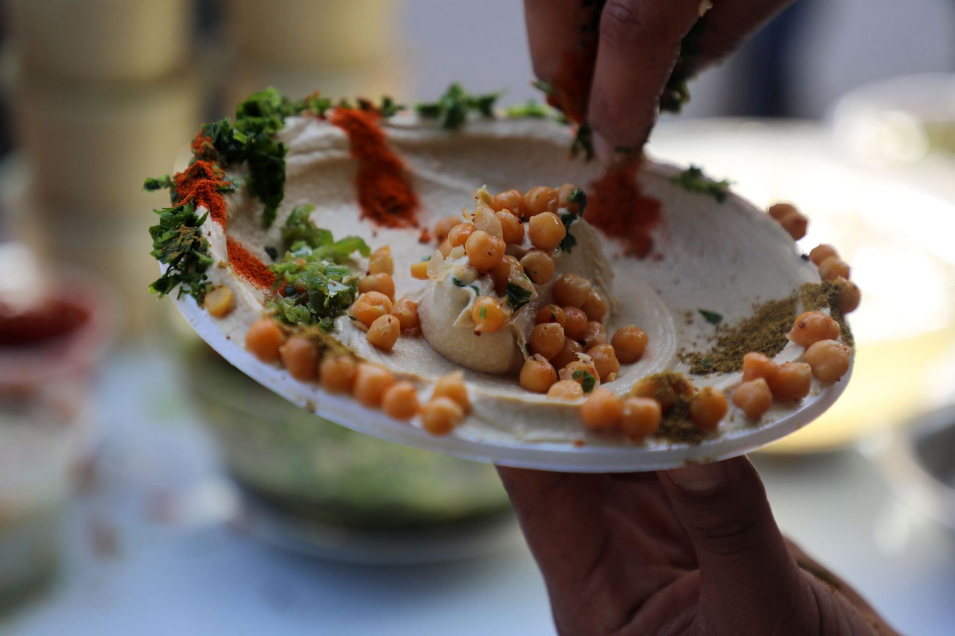 Hummus is a versatile dip often paired with pita bread, chips, etc. - Source: Getty