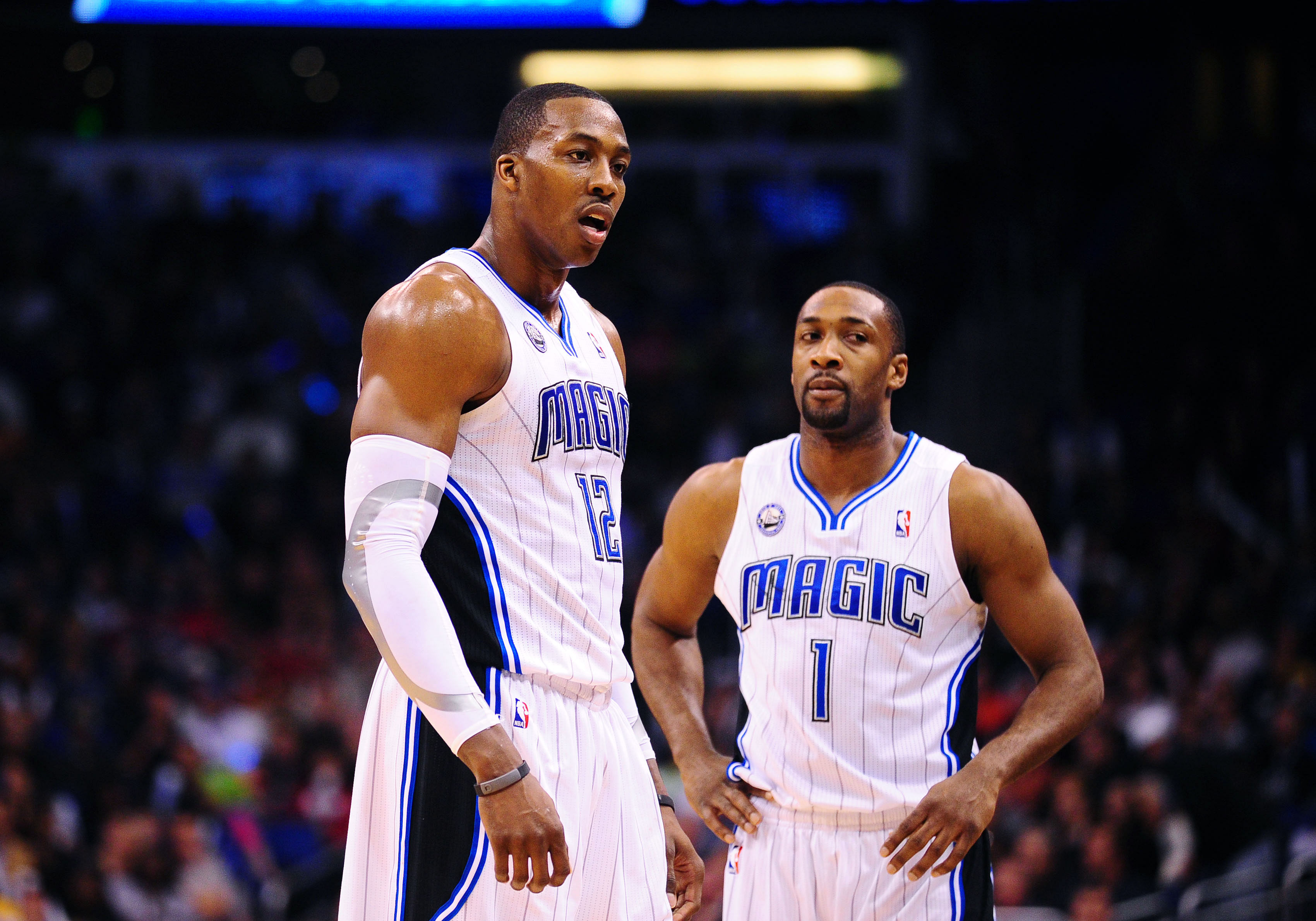 Feb. 11, 2011; Orlando, FL, USA; Orlando Magic center Dwight Howard (12) and guard Gilbert Arenas (1) against the New Orleans Hornets at the Amway Center. The Hornets defeated the Magic 99-93. Mandatory Credit: Mark J. Rebilas-Imagn Images - Source: Imagn