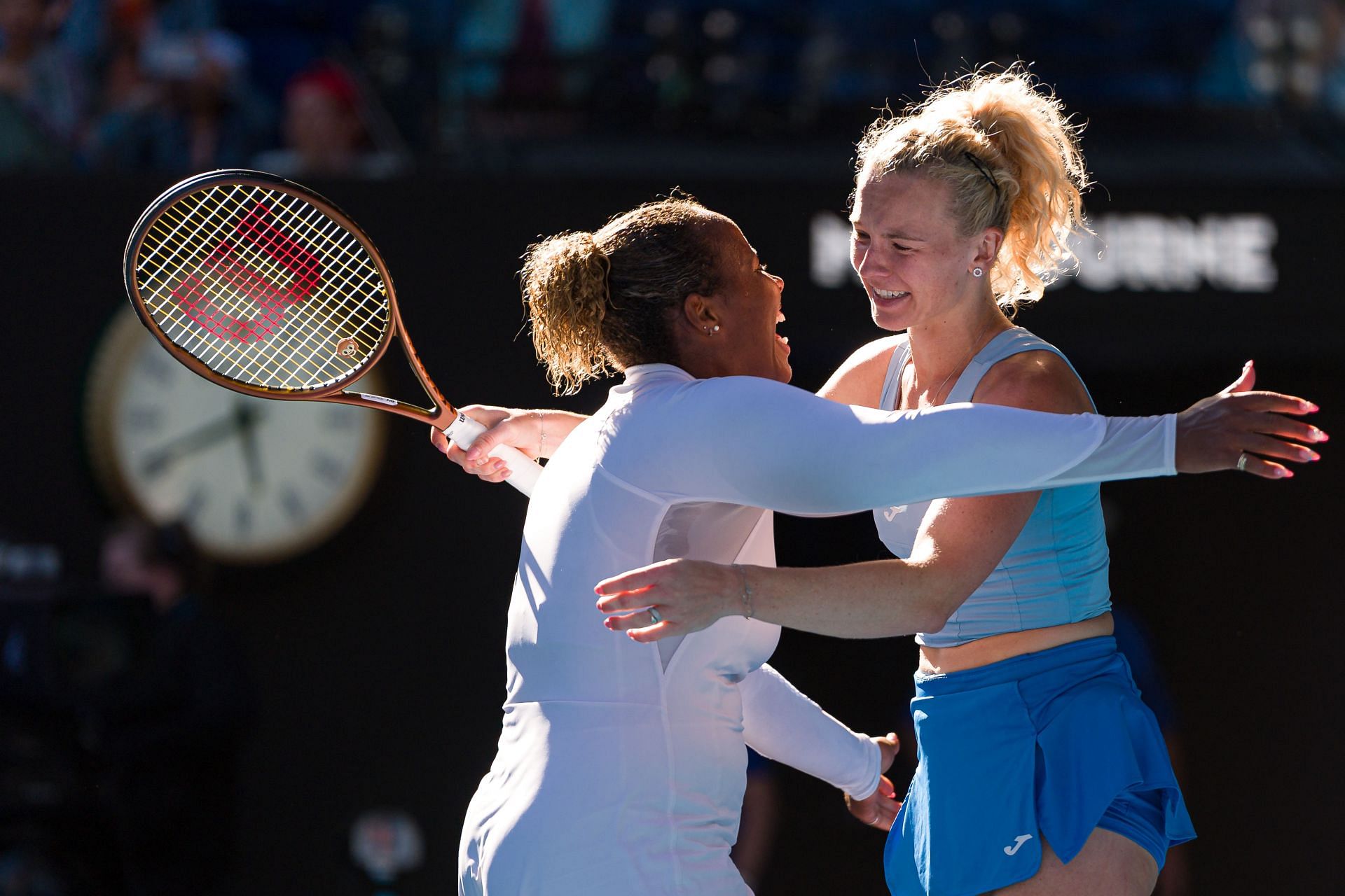 Katerina Siniakova and Taylor Townsend embrace after win - Source: Getty