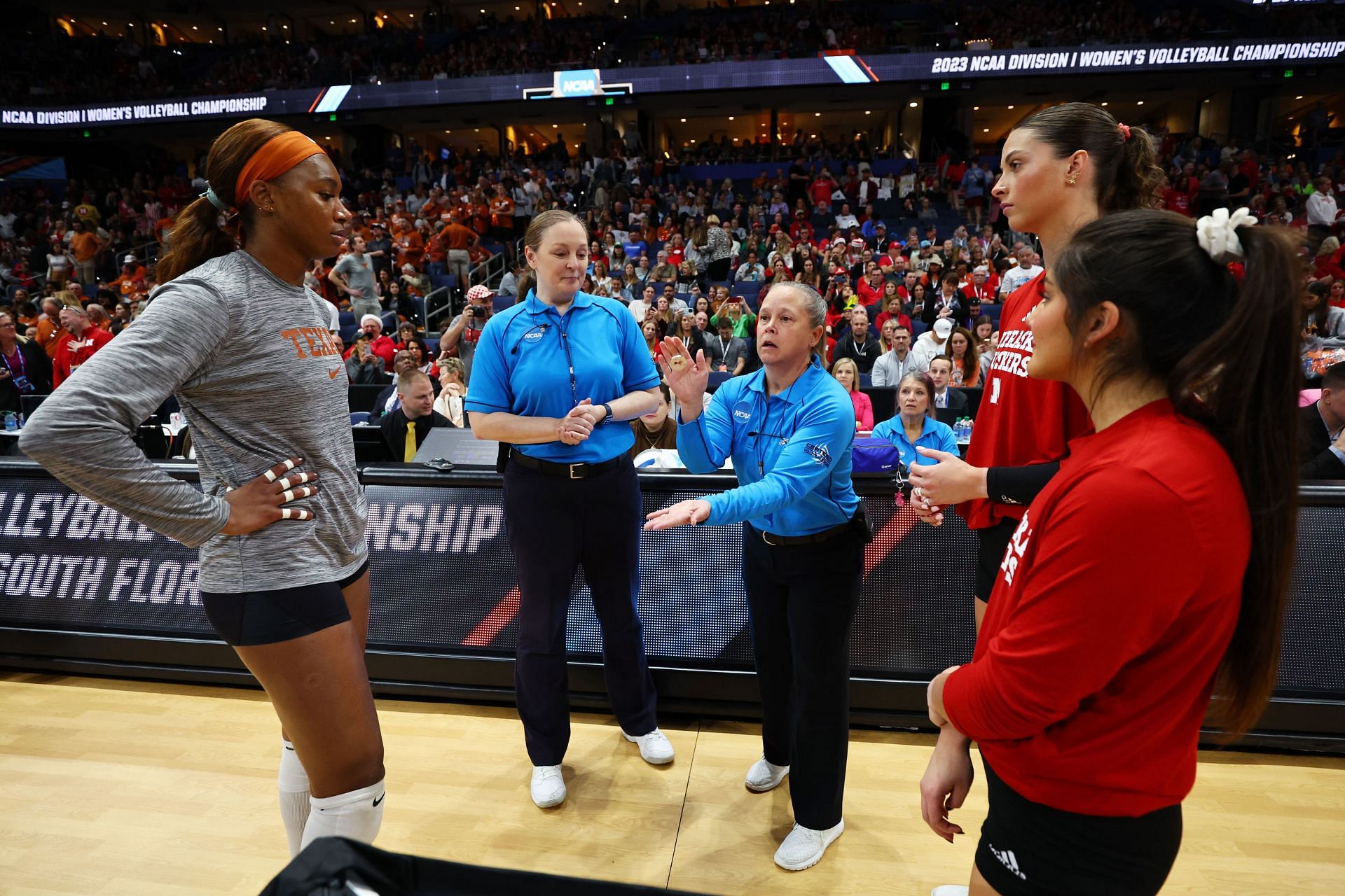 Beason and Lexi Rodriguez during the coin toss with the University of Texas captain during the 2023 NCAA Championships (Image via: Getty Images)