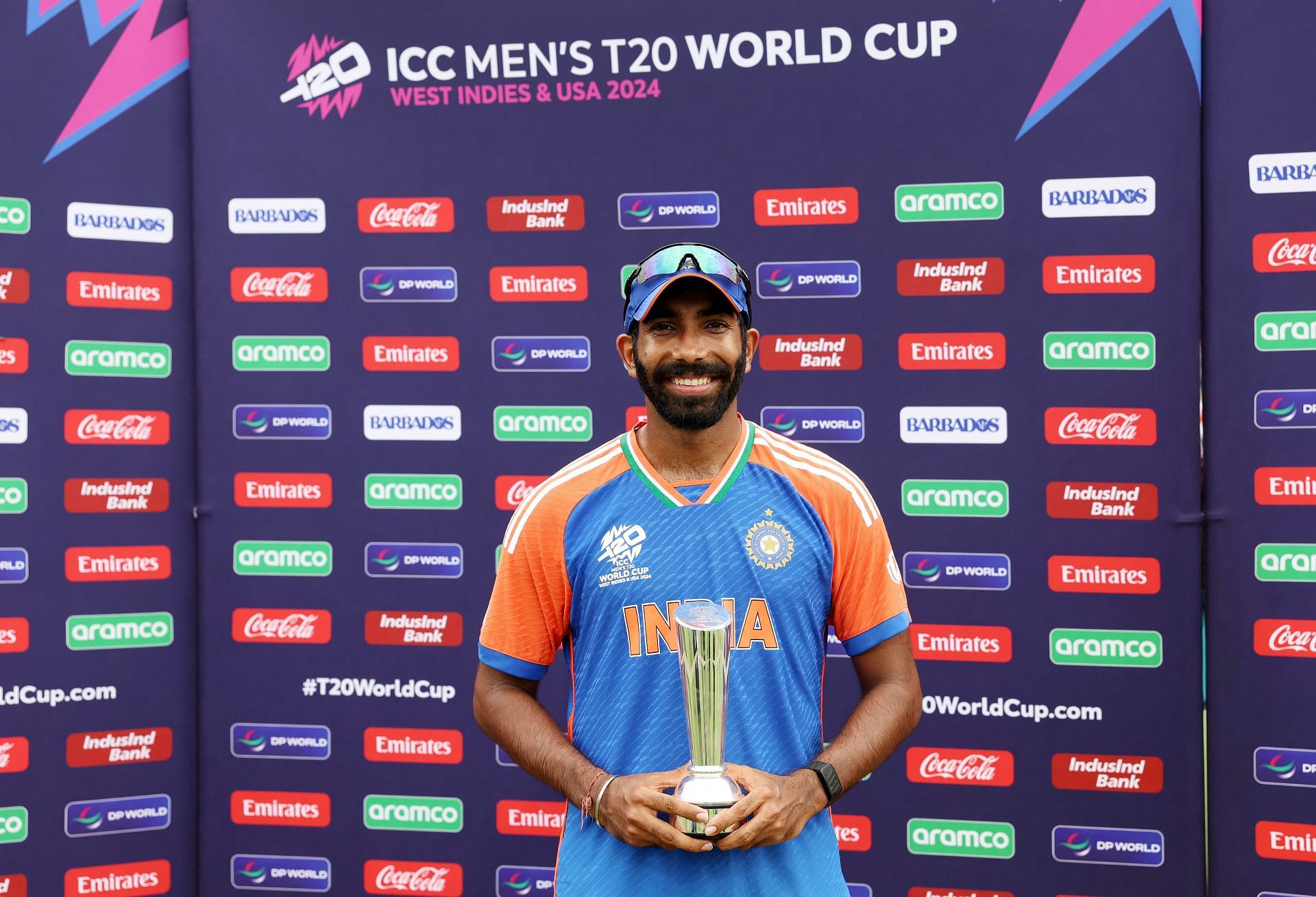 Jasprit Bumrah poses with the Man of the Series Trophy after India's World Cup win in 2024..Source: Getty
