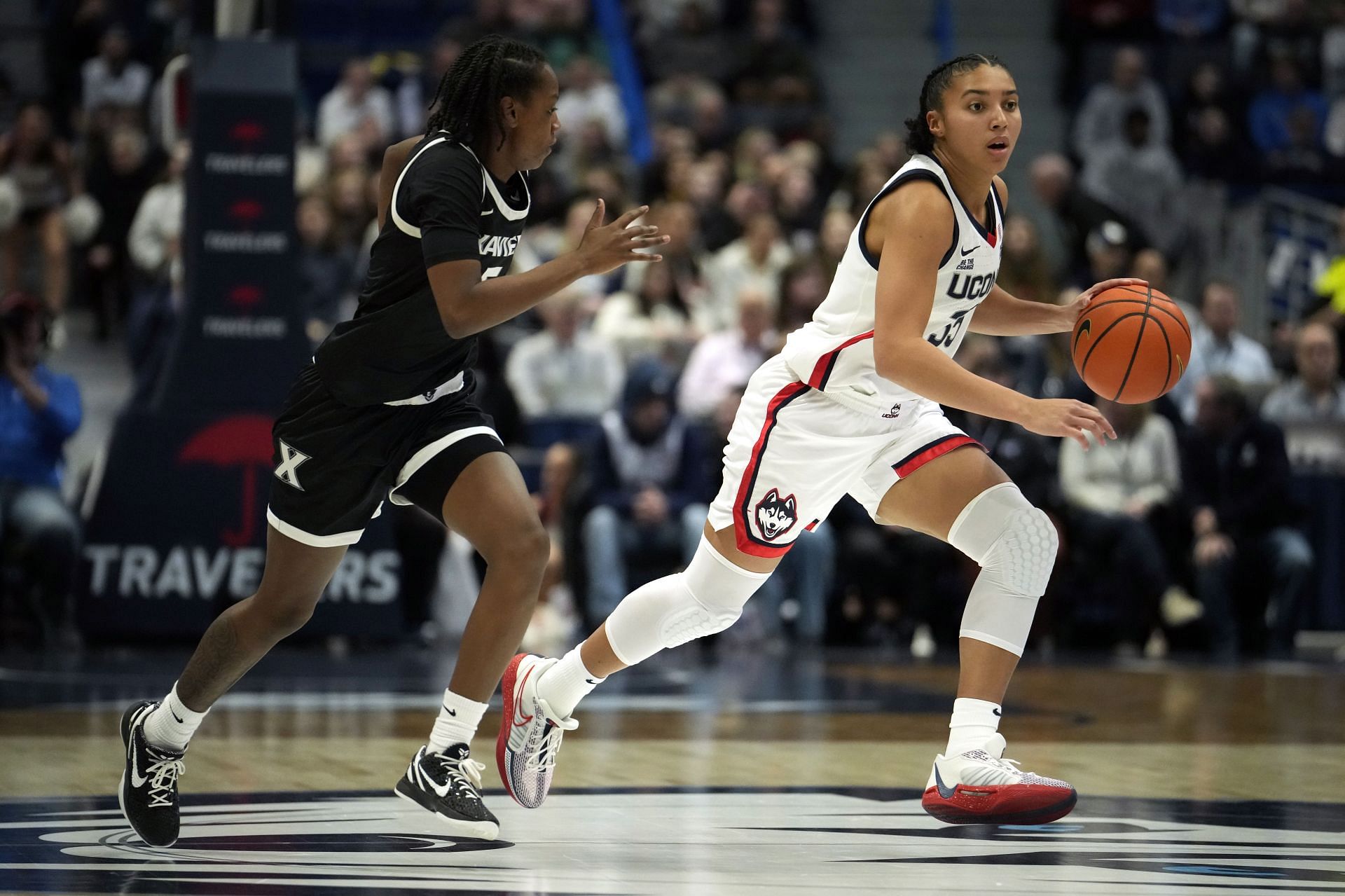 Azzi Fudd (#35) of the UConn Huskies attacks the defense of Tae&rsquo;lor Purvis (#5) of the Xavier Musketeers during the first half of their NCAA game at the XL Center on January 8, 2025 in Hartford, Connecticut. Photo: Getty