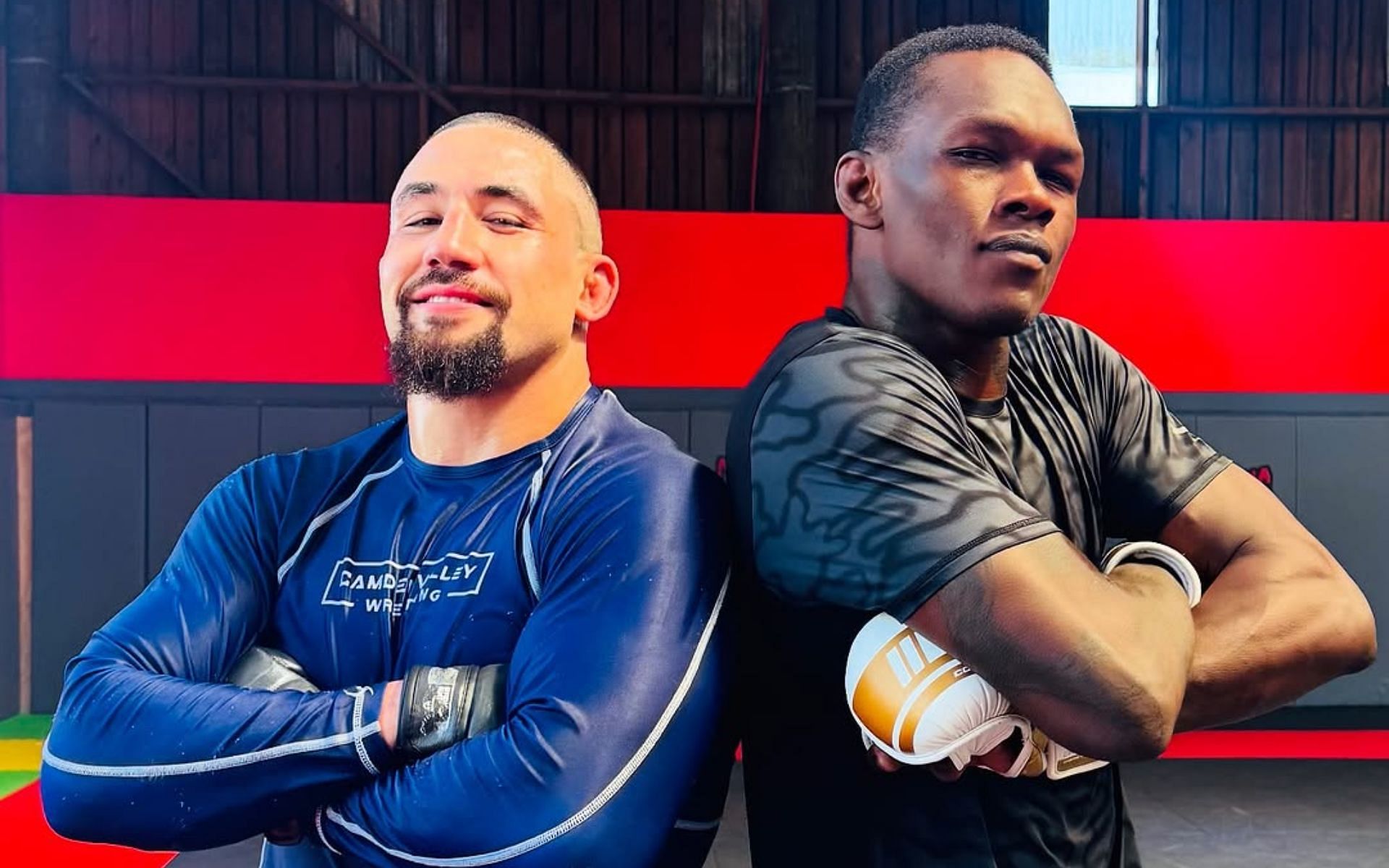 Israel Adesanya (right) shares photo with former foe Robert Whittaker (left). [Image courtesy: @stylebender on Instagram]