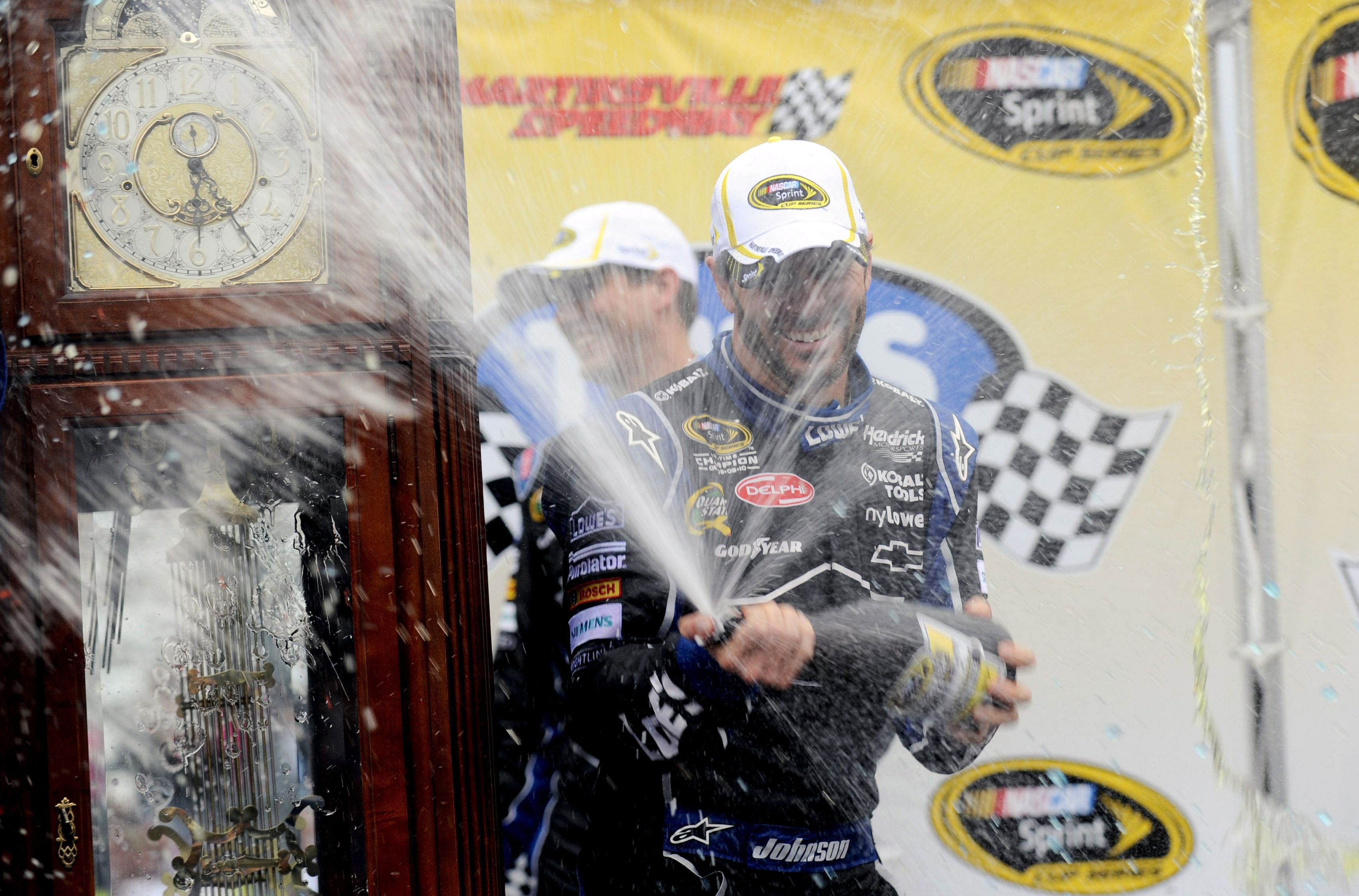 Jimmie Johnson celebrates in victory lane after winning the Tums Fast Relief 500 at Martinsville Speedway - Source: Imagn