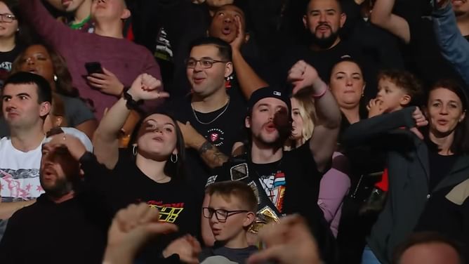 [WATCH] Massive botch on RAW; fan accidentally kicked by WWE star and falls out of chair