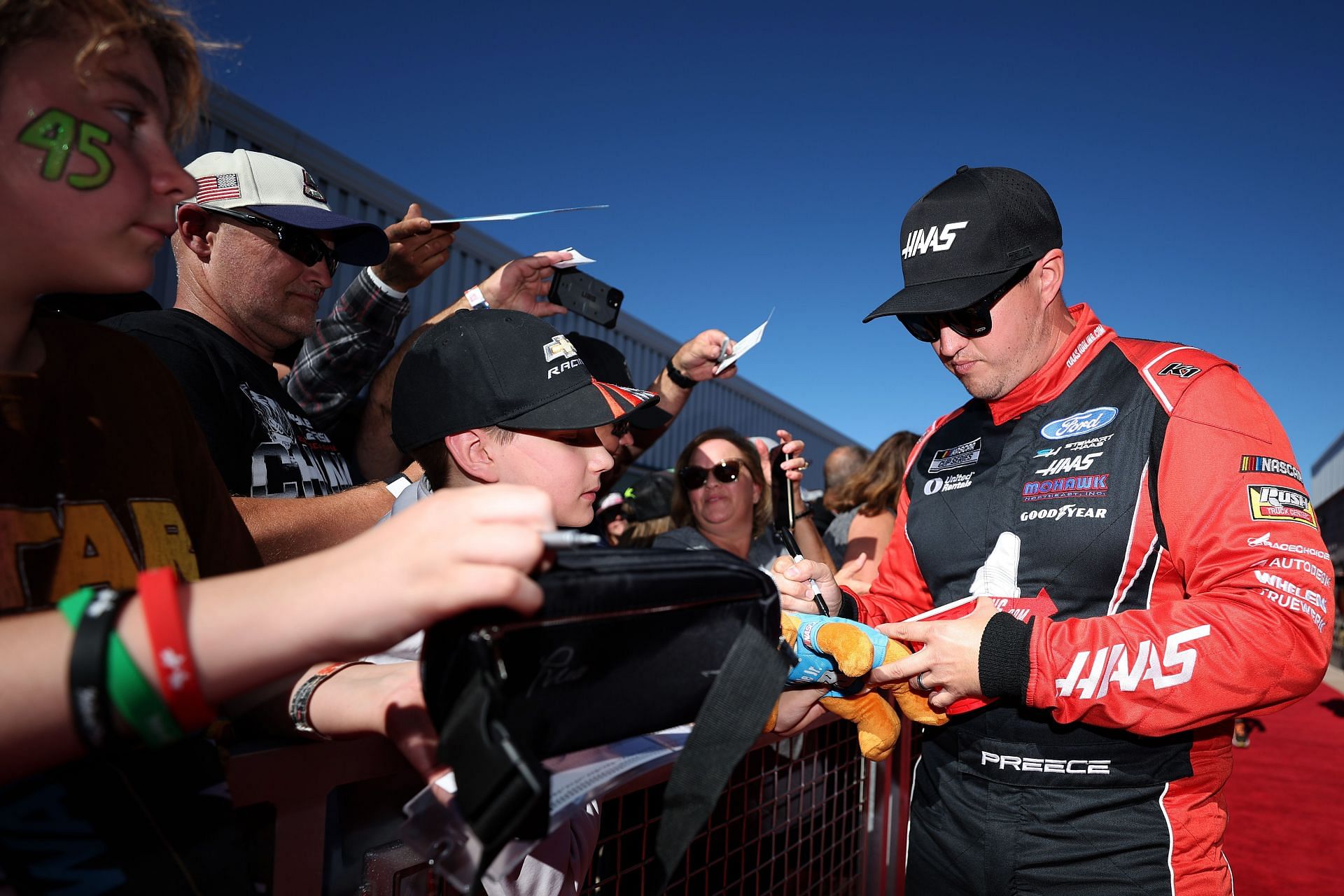 In Picture: Ryan Preece signs autographs for NASCAR fans on the red carpet before the NASCAR Cup Series Championship Race at Phoenix Raceway on November 10, 2024 - Source: Getty