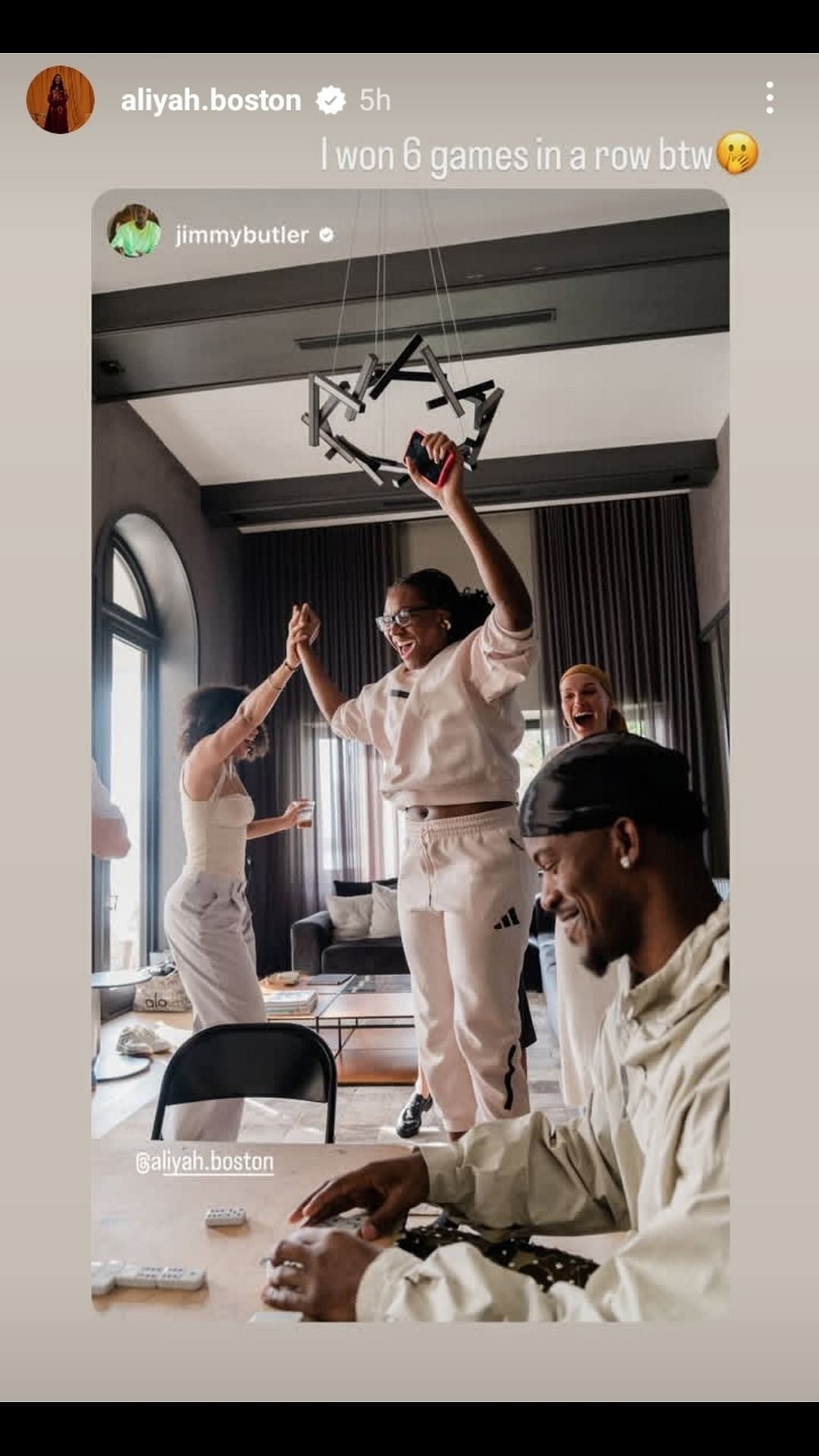 Aliyah Boston celebrates winning six straight games of dominoes over Jimmy Butler. Image source: IG.com/aliyah.boston