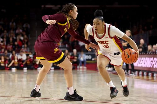 JuJu Watkins (#12) of the USC Trojans drives past Amaya Battle (#3) of the Minnesota Golden Gophers during the fourth quarter at Galen Center on Jan. 30, 2025, in Los Angeles, California. Photo: Getty