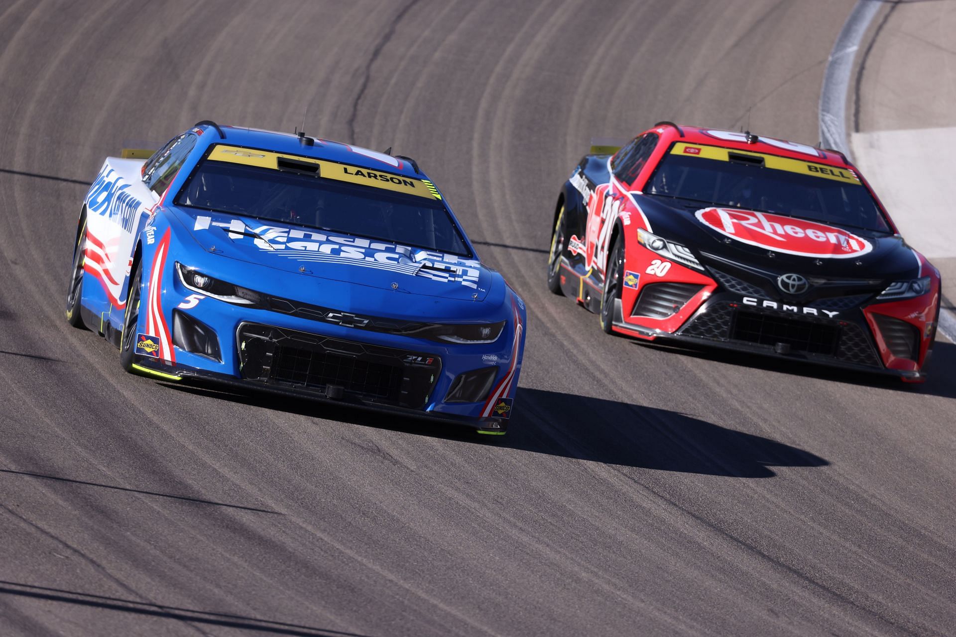 Kyle Larson (#5 Hendrick Motorsports HendrickCars.com Chevrolet) and Christopher Bell (#20 Joe Gibbs Racing Rheem/Smurfit Kappa Toyota) during the South Point 400 NASCAR Cup Series Playoff race on October 15, 2023, Las Vegas Motor Speedway in Las Vegas, NV - Source: Getty