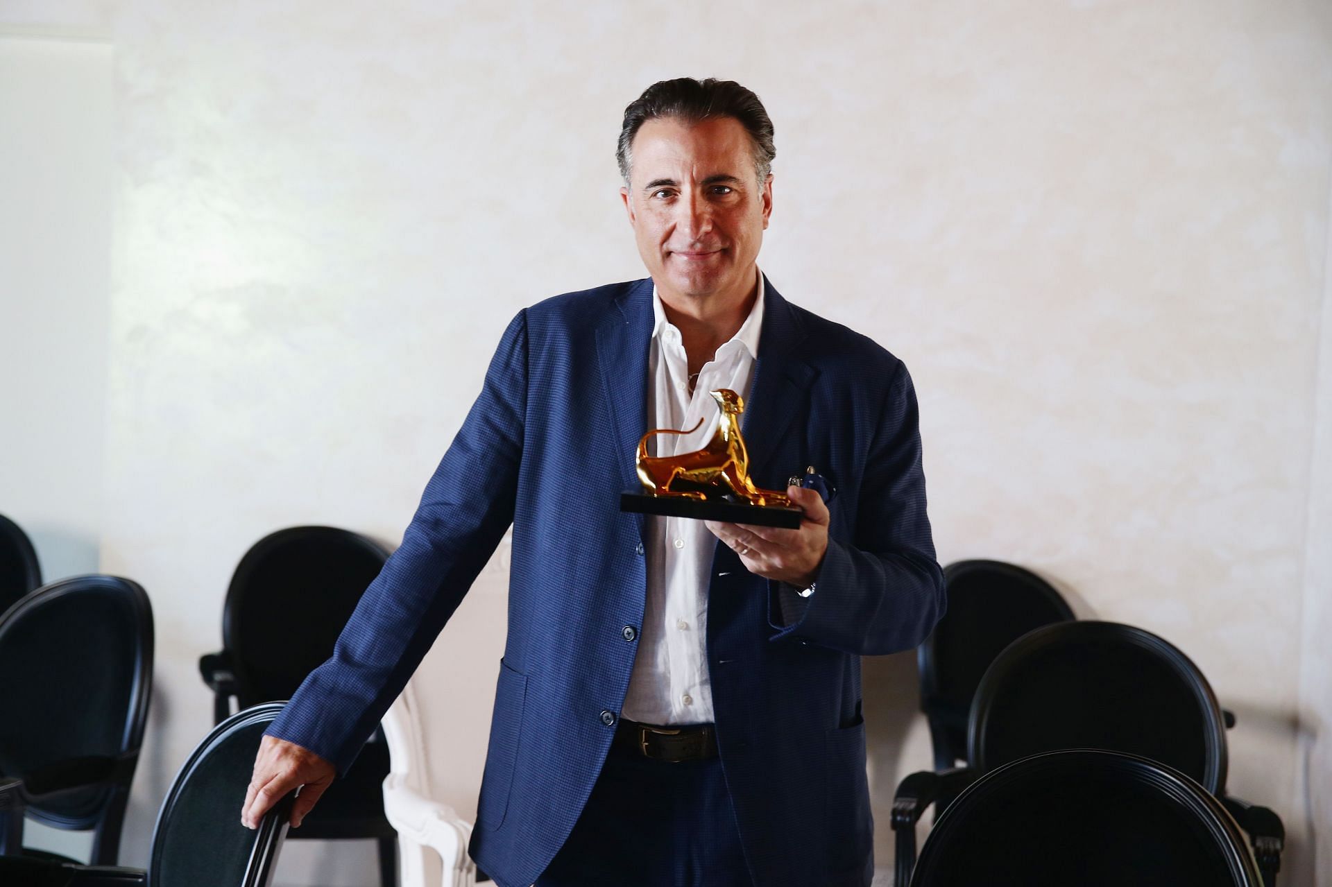 Actor Andy Garcia poses with the Leopard Club Award 2015 on August 7, 2015 in Locarno, Switzerland. (Image via Vittorio Zunino Celotto/Getty Images)