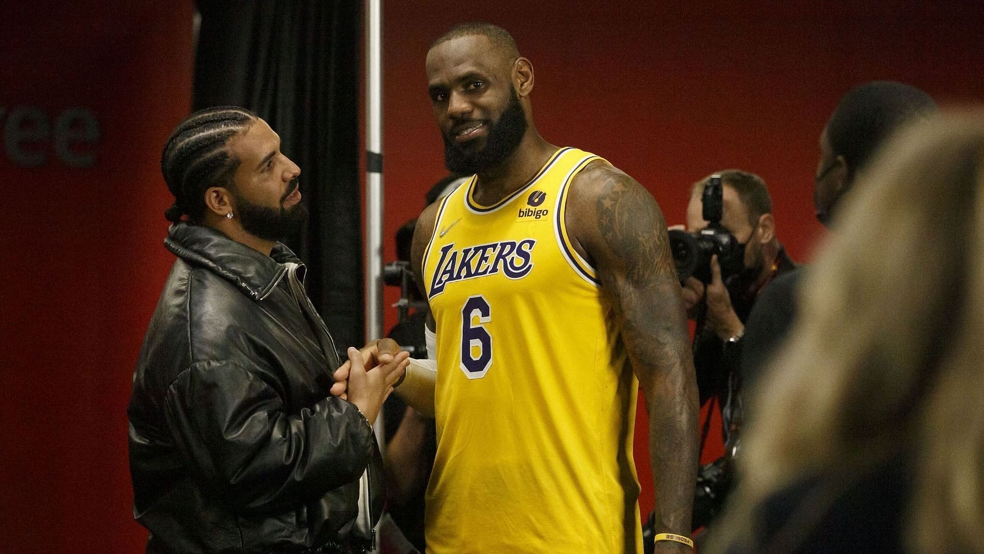 Drake and LeBron James #6 of the Los Angeles Lakers talk after the NBA game between the Toronto Raptors and the Los Angeles Lakers at Scotiabank Arena on March 18, 2022, in Toronto, Canada. (Image via Getty/Cole Burston)