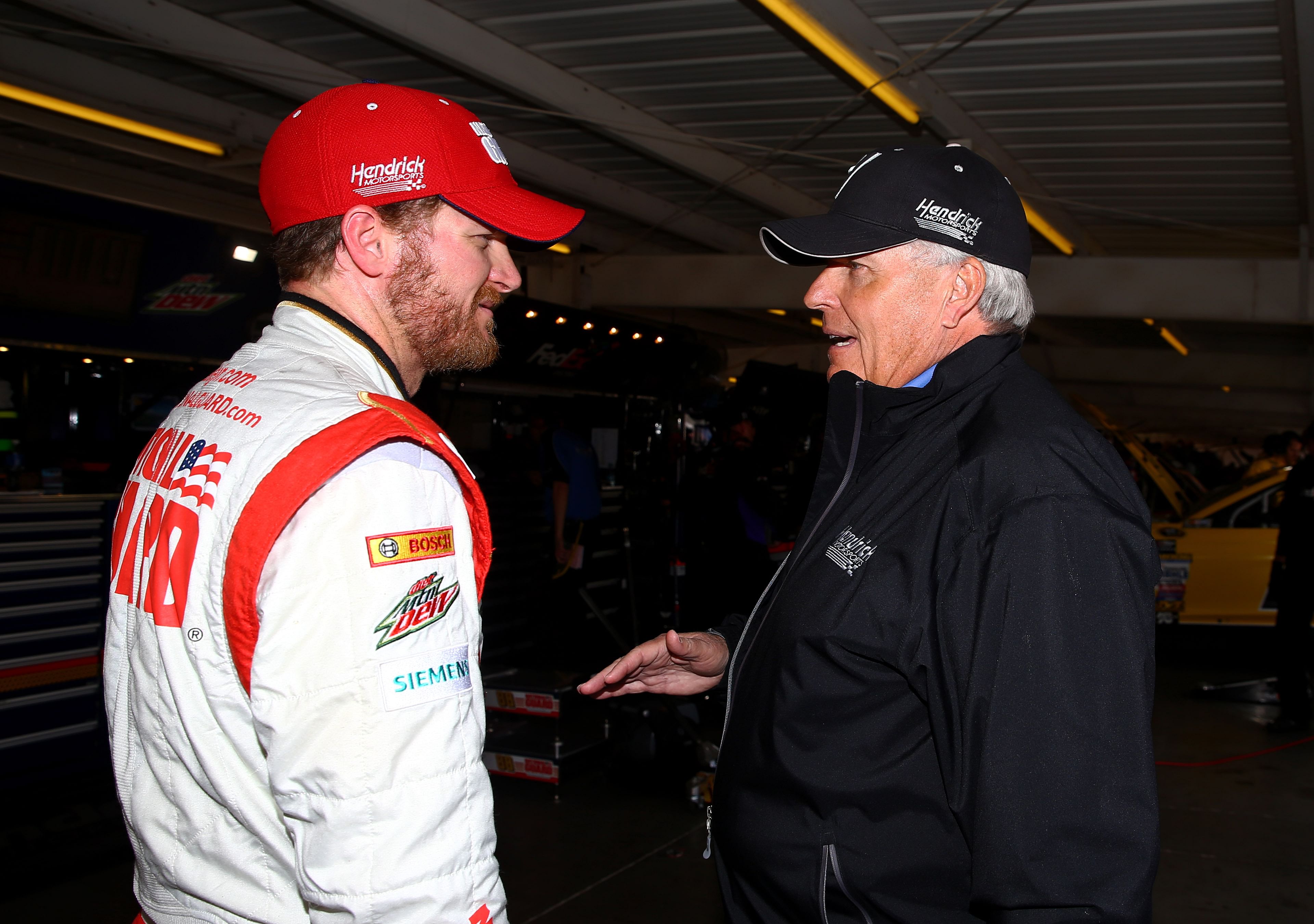 Dale Earnhardt Jr. talks with team owner Rick Hendrick during practice for the The Profit on CNBC 500 at Phoenix International Raceway on March 1st, 2014 - Source: Imagn