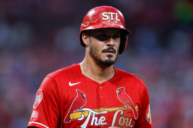 Nolan Arenado turns up the style in retro-themed graphic tee & beanie at the plate during batting practice