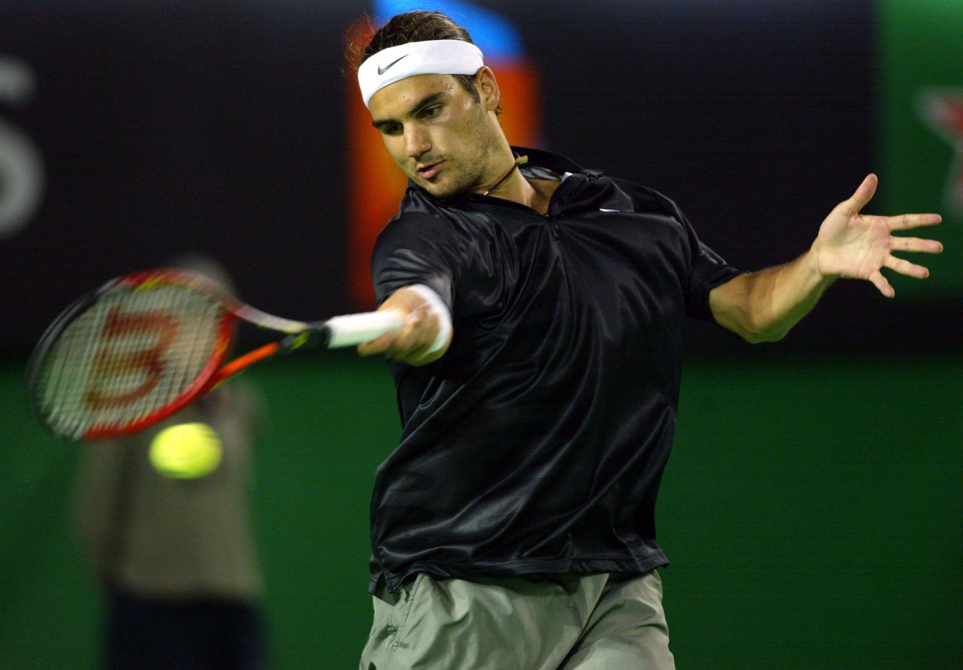 The Swiss maestro strikes a ball at Australian Open 2002 (Source: Getty)