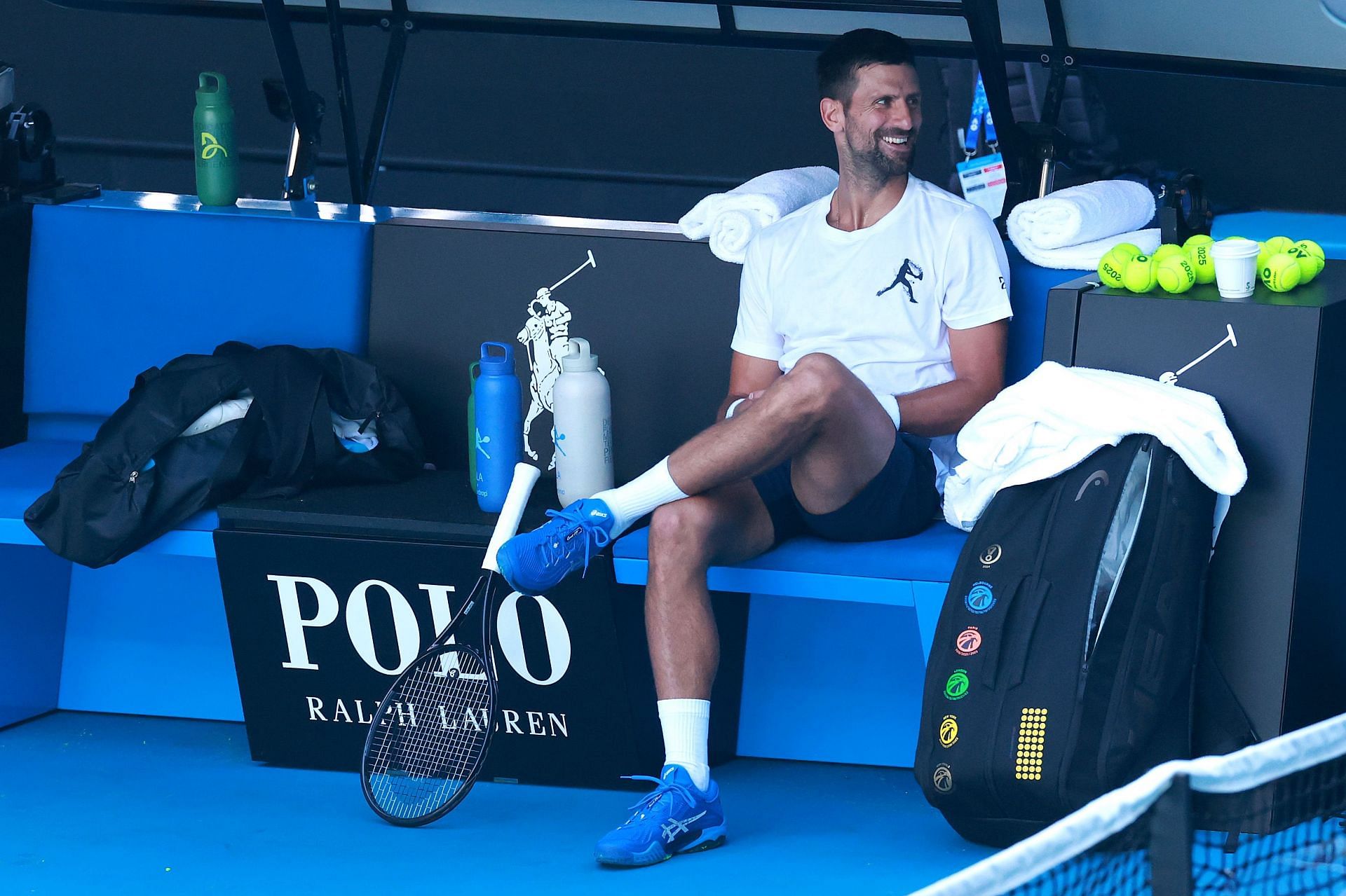 10-time Australian Open champion looks on during practice