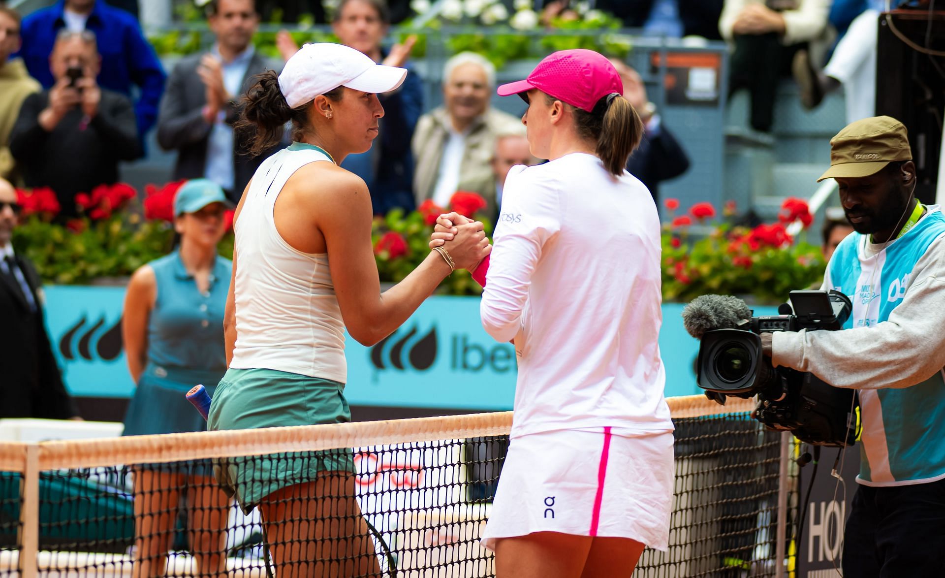 Madison Keys of the United States &amp; Iga Swiatek of Poland shake hands at the net after the semi-final on Day Ten of the Mutua Madrid Open at La Caja Magica on May 02, 2024 in Madrid, Spain - Source: Getty