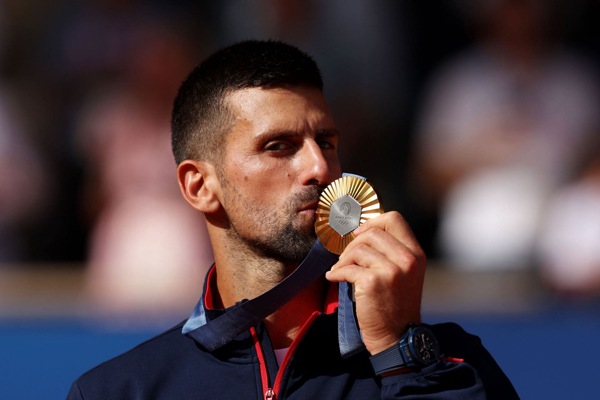 Novak Djokovic kissing the gold medal at 2024 Olympics - Source: Getty