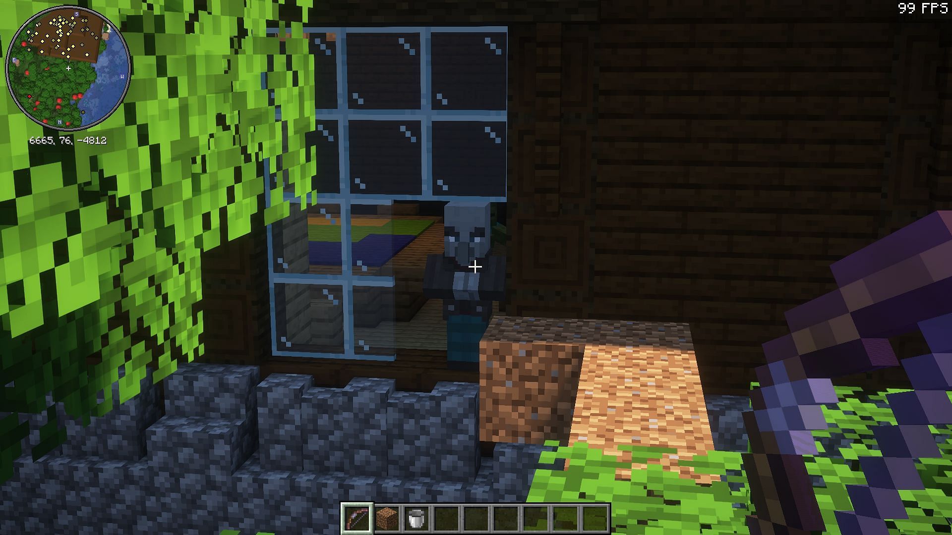 Break the mansion&#039;s windows and target illagers from the outside (Image via Mojang Studios)