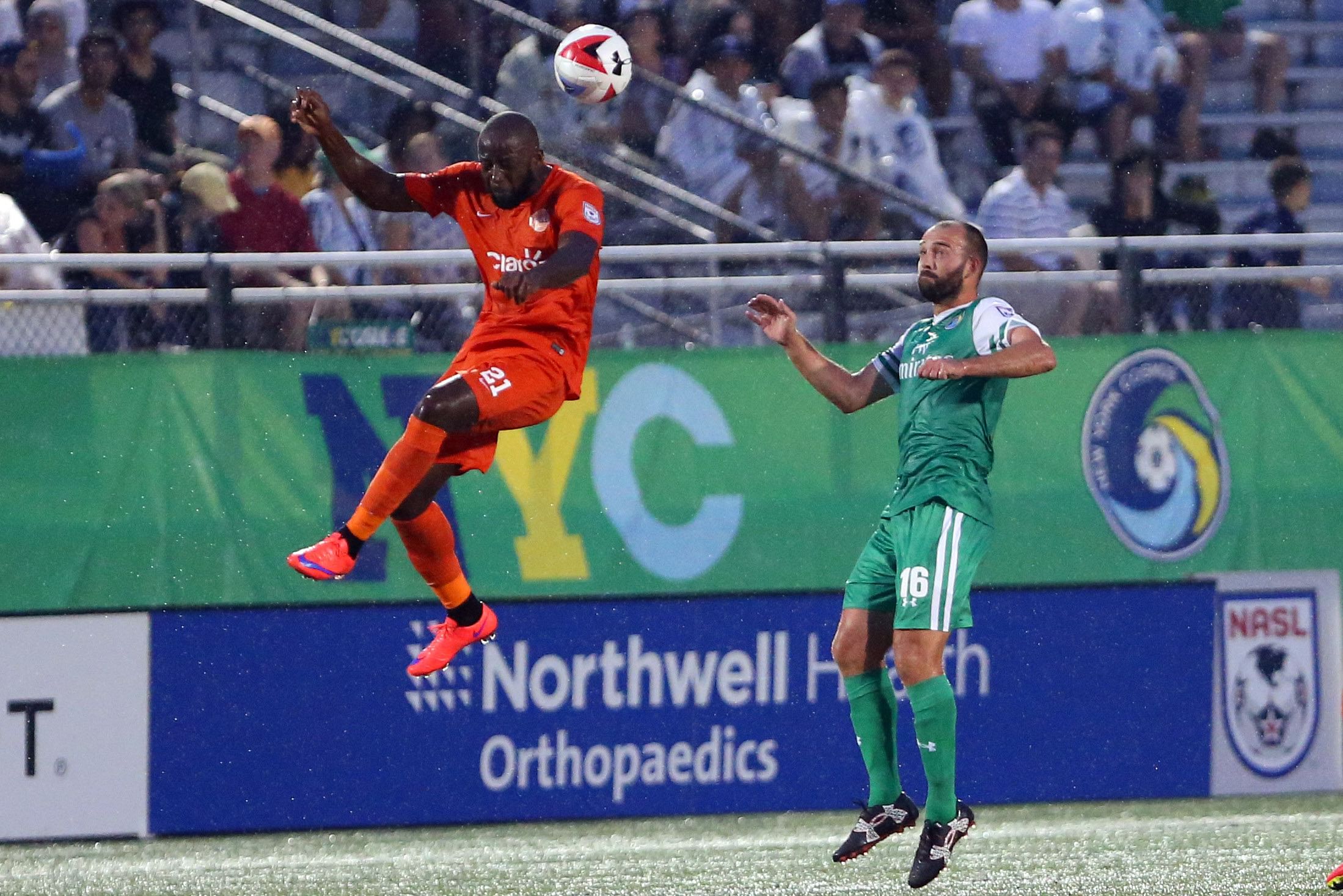 Puerto Rico FC midfielder Michael Kafari (21) heads the ball during an NASL game against the New York Cosmos. (Credits: IMAGN)