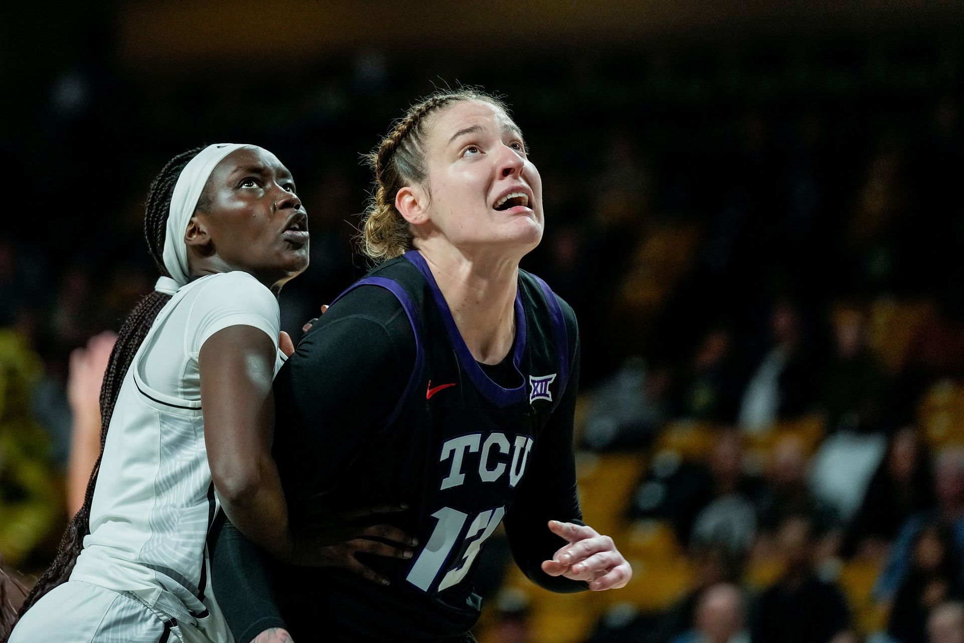 TCU Horned Frogs center Sedona Prince (13) and UCF Knights forward Adeang Ring (22) position themselves for a rebound during their game on December 21, 2024 at Addition Financial Arena in Orlando, Florida. Photo: Getty