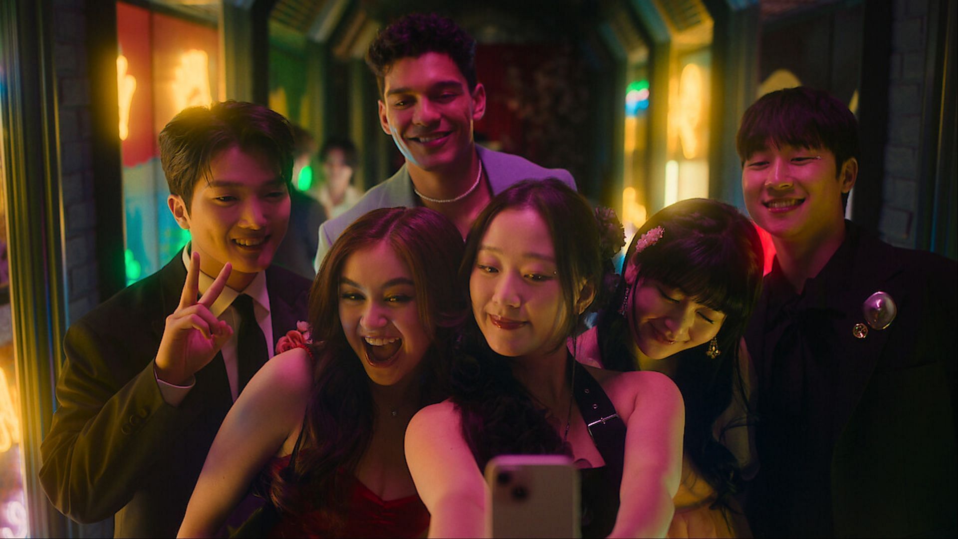 The XO, Kitty cast in a cheerful moment at school dance (via Netflix/Tudum)