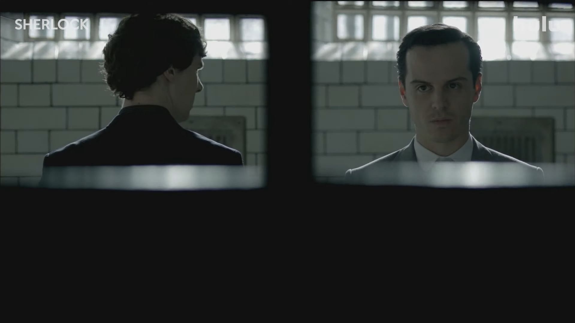 Sherlock Holmes, played by Benedict Cumberbatch, alongside James Moriarty. (Image via Hulu)