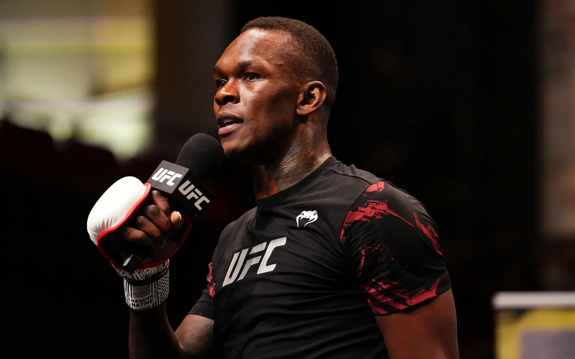 Israel Adesanya (pictured) explains the impact his dad had on how he viewed his training schedule [Image courtesy: Getty Images]