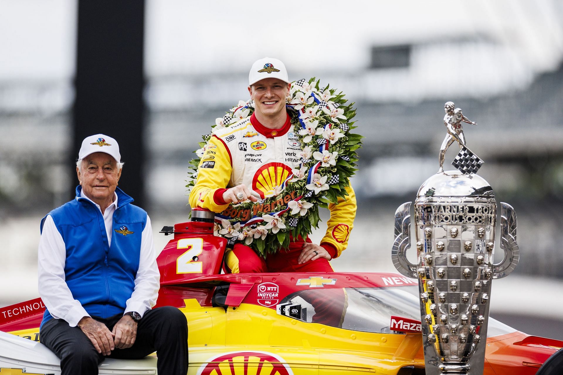 Roger Penske poses for a photo with Josef Newgarden during the 108th Indianapolis 500 champion&#039;s portraits at Indianapolis Motor Speedway - Source: Getty