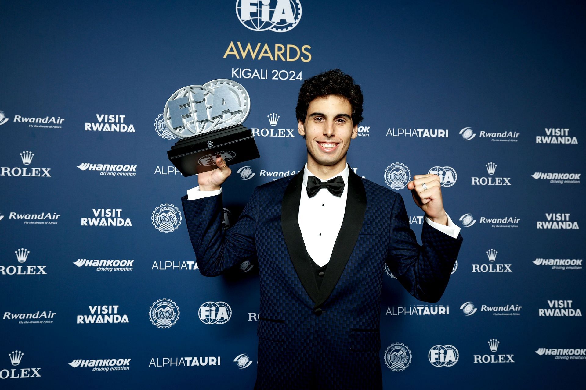 F2 Drivers Champion Gabriel Bortoleto poses for a photograph with the trophy during the FIA Awards 2024 - Source: Getty