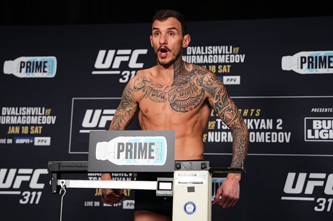 Overwhelmed Renato Moicano reacts after being awarded title opportunity against Islam Makhachev at UFC 311