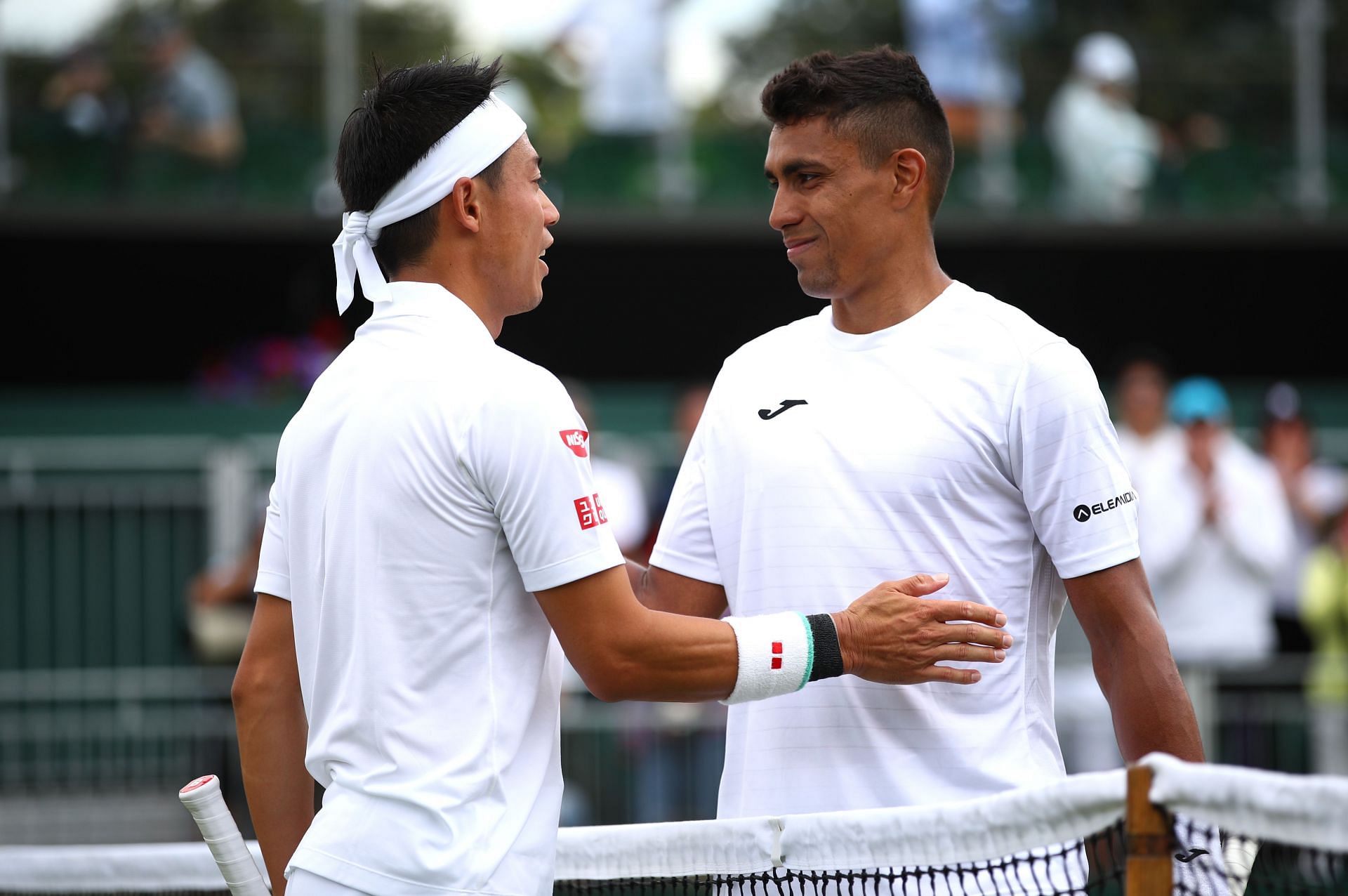 Nishikori (L) and Monteiro on Day Two: The Championships - Wimbledon 2019 - Source: Getty